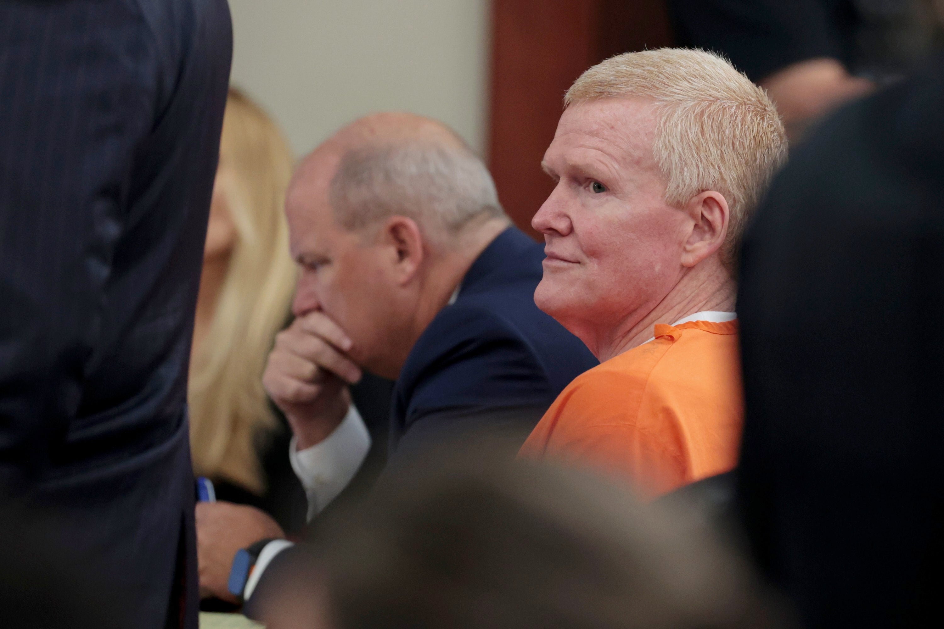 Murdaugh wore an orange prison jumpsuit in court Monday, mostly listening with his mouth fixed in a tight line (Tracy Glantz/Pool The State  via)