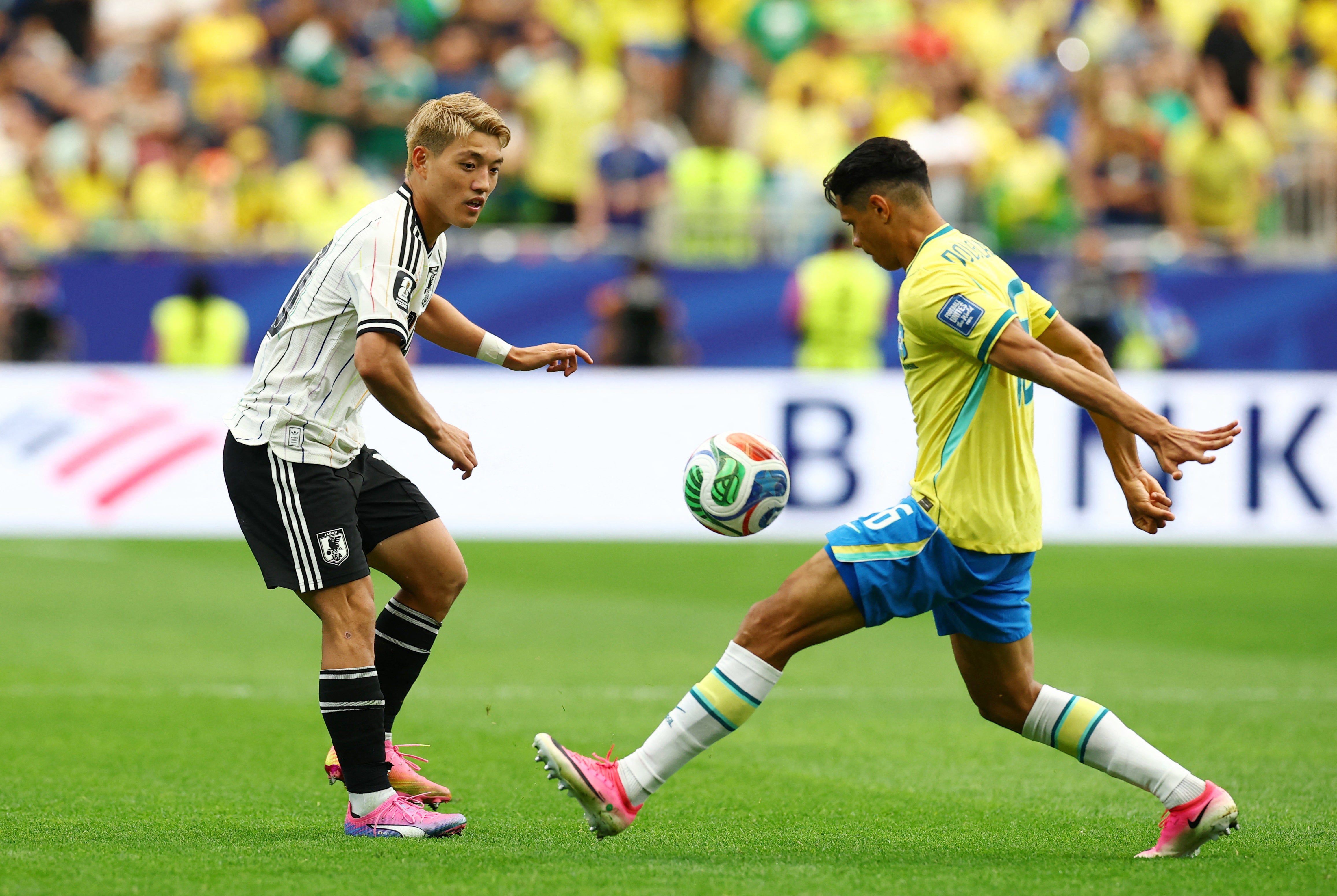 Japan's Ritsu Doan in action with Brazil's Douglas Santos (Reuters)