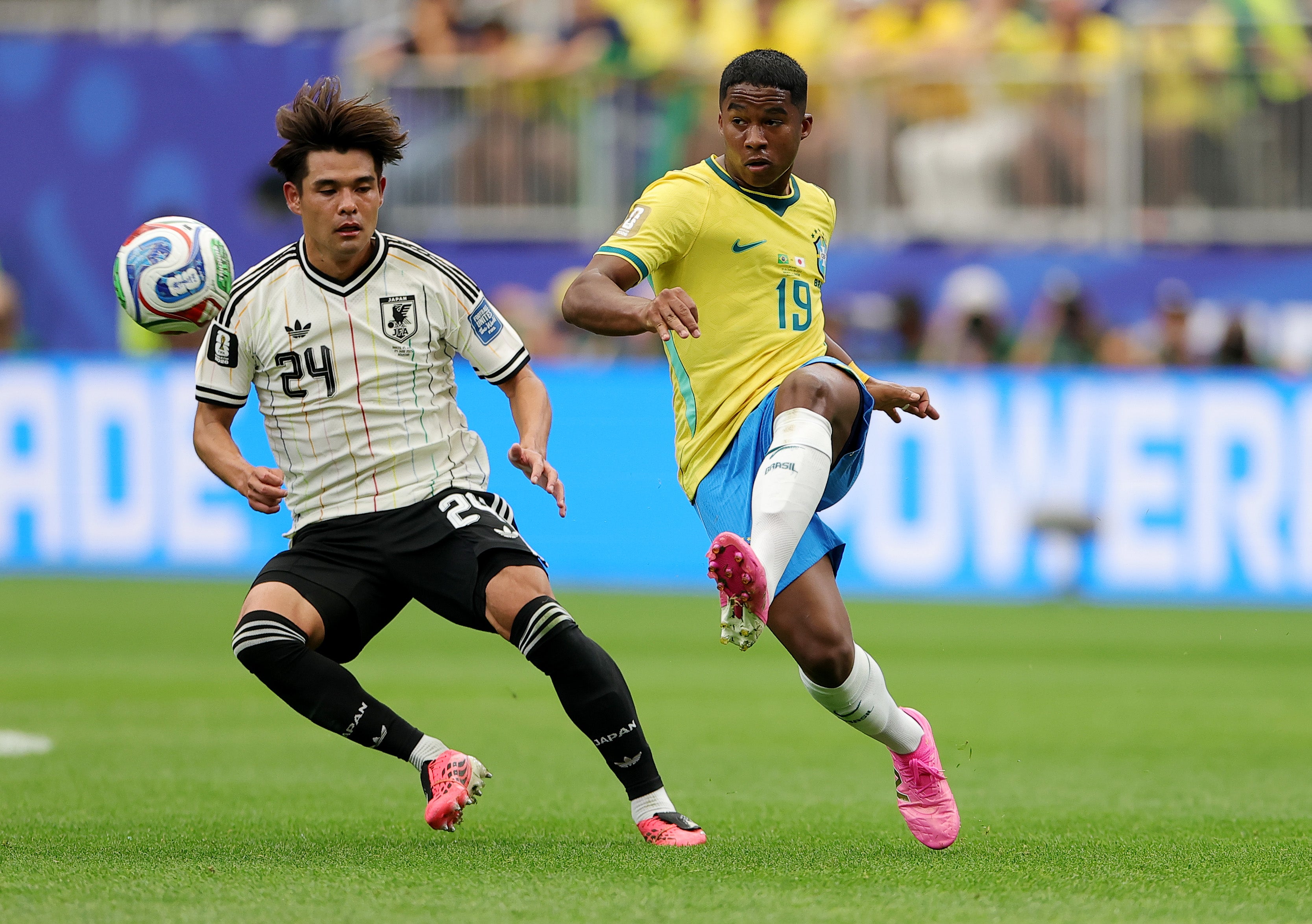 Endrick #19 of Brazil passes the ball against Kaishu Sano #24 of Japan (Getty)