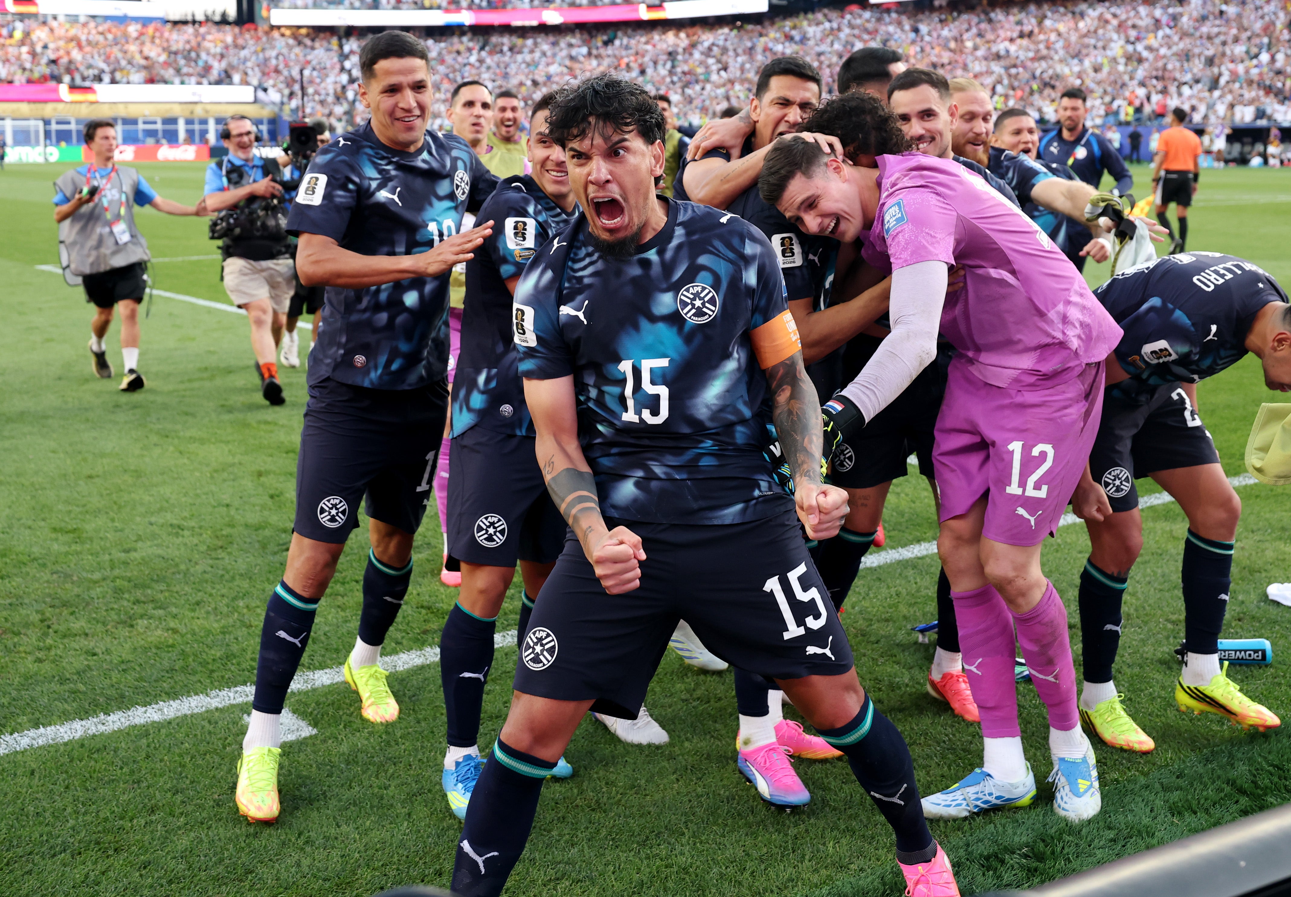 Paraguay players celebrate knocking Germany out of the World Cup