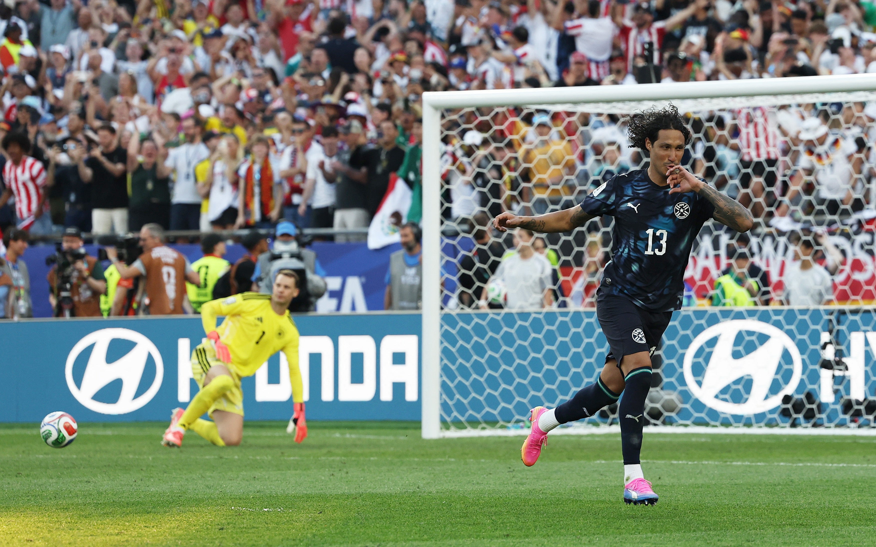 Paraguay's Jose Canale celebrates scoring a penalty during the penalty shootout to win the match