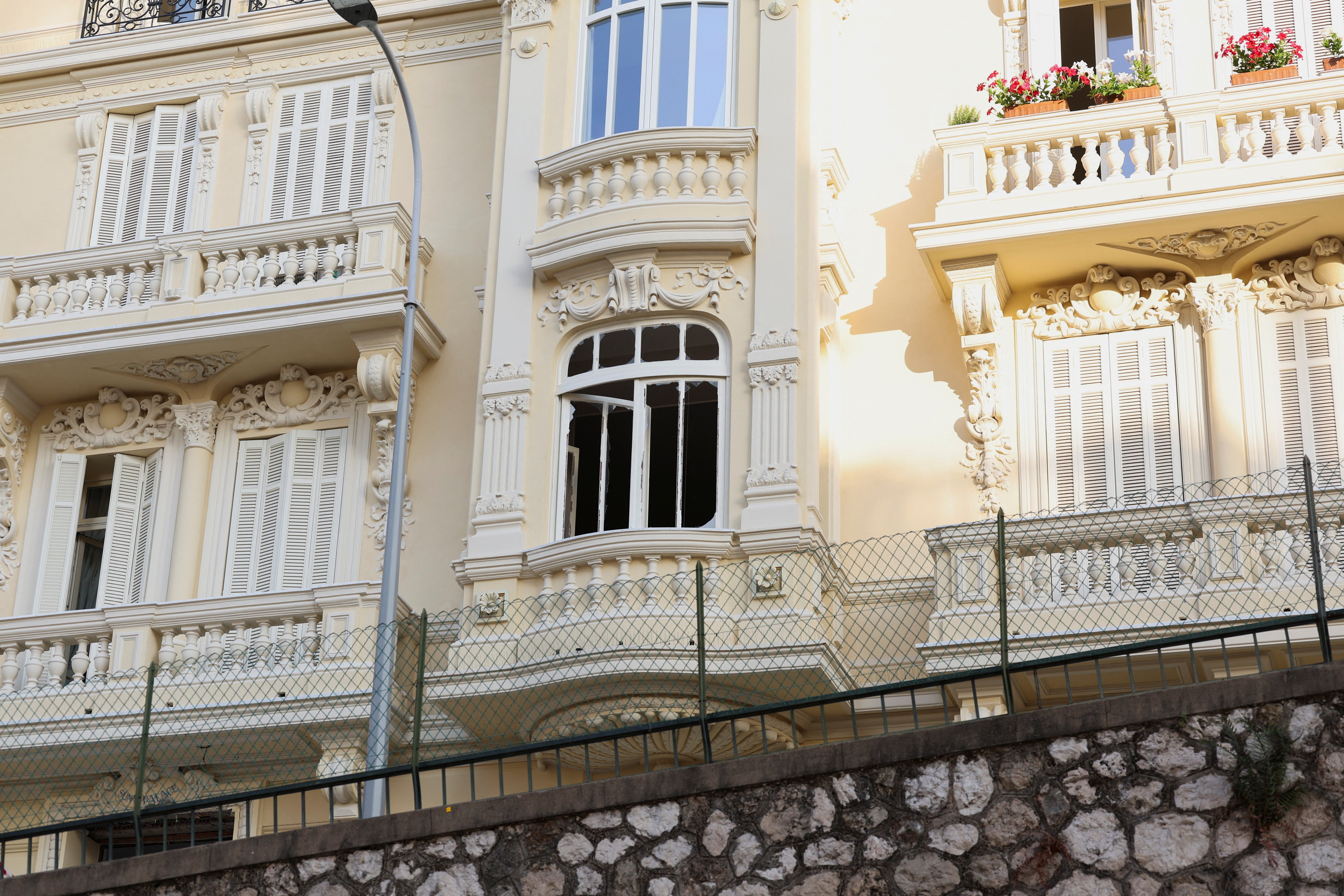 The damaged window of a residential building following an explosion on Monday, in Monaco