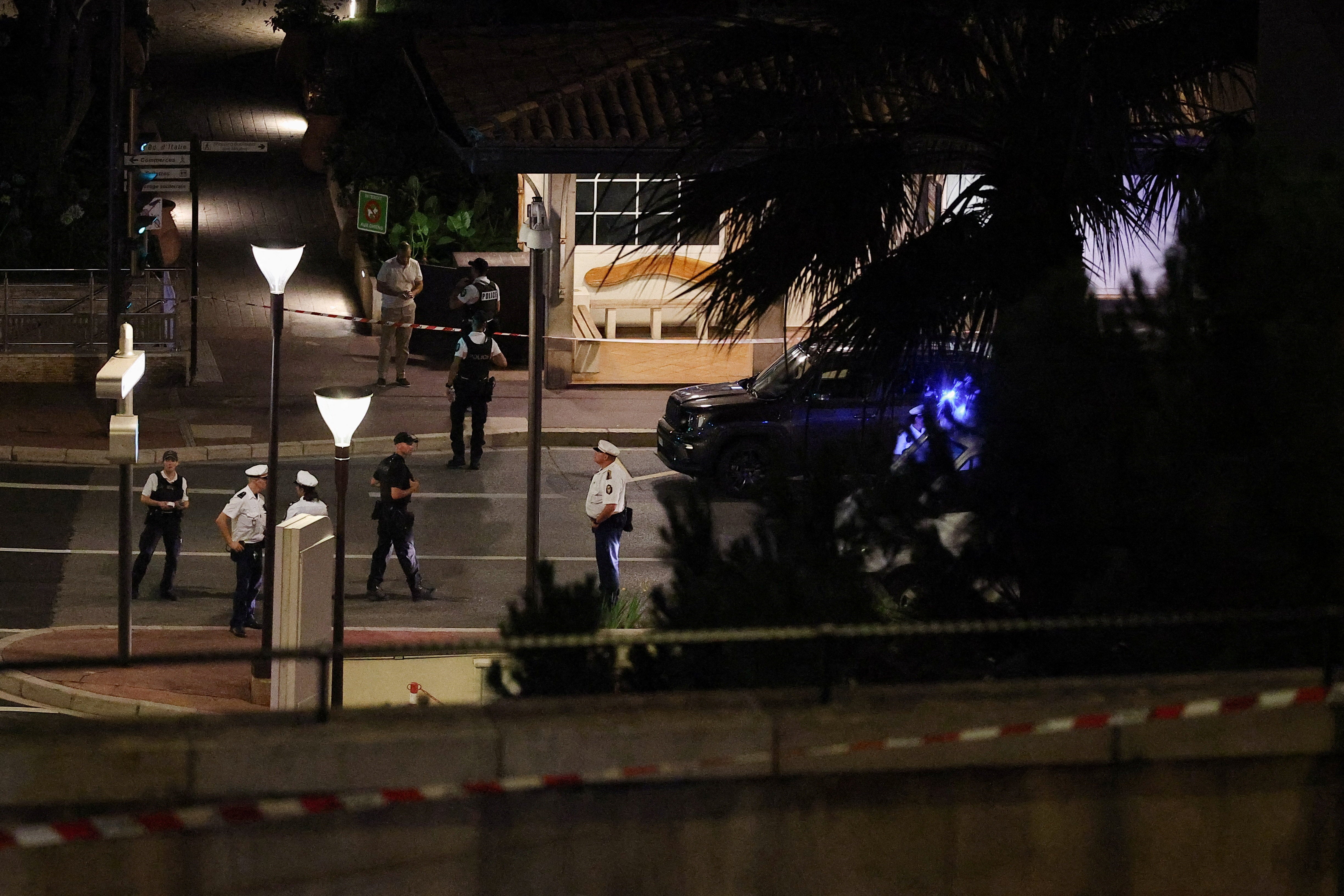 Police officers stand guard after an explosion was reported, on Boulevard d'Italie, in Monaco