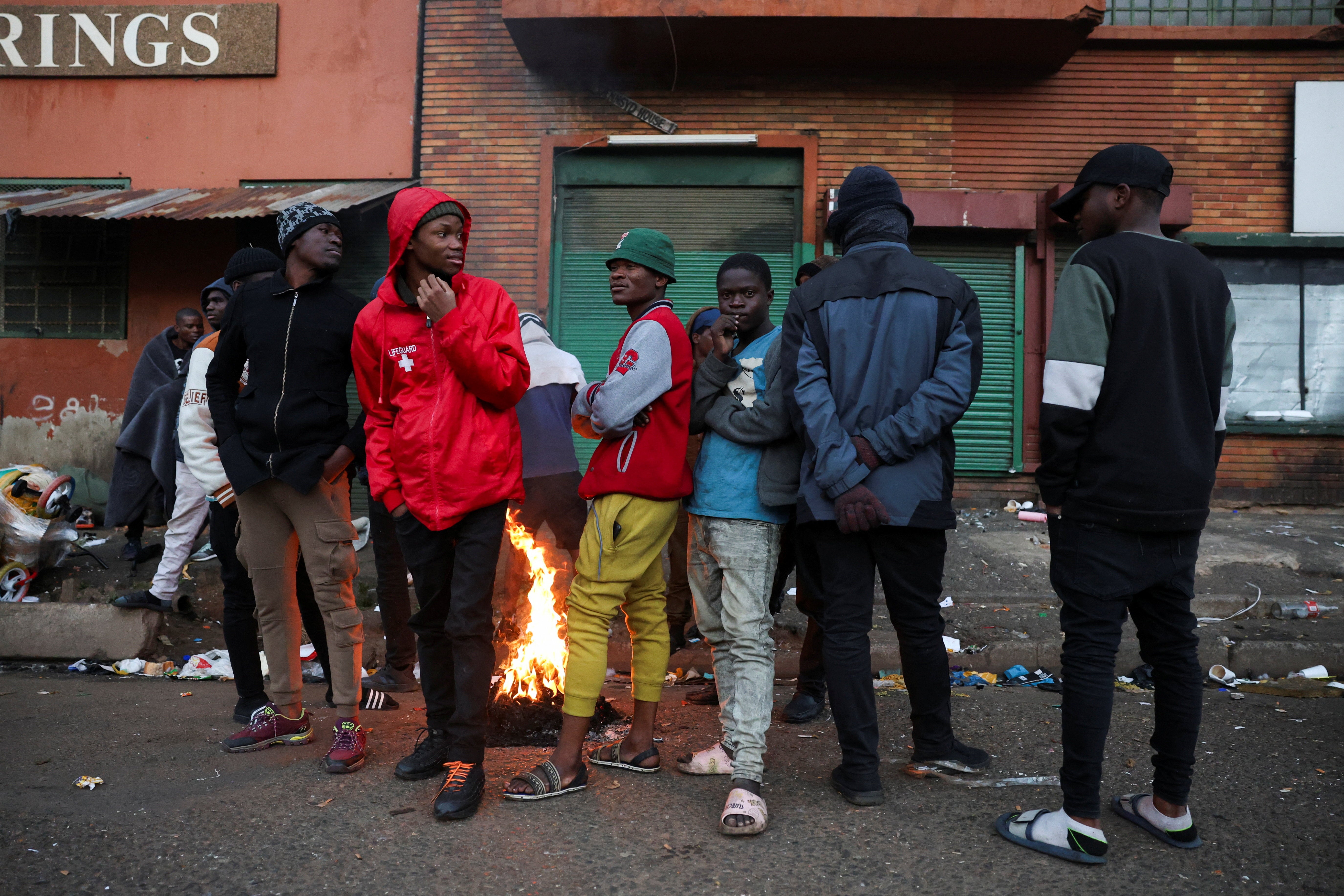 Malawians wait to be taken by the police from Doornfontein in Johannesburg CBD to Lindela Repatriation Centre in Krugersdorp.