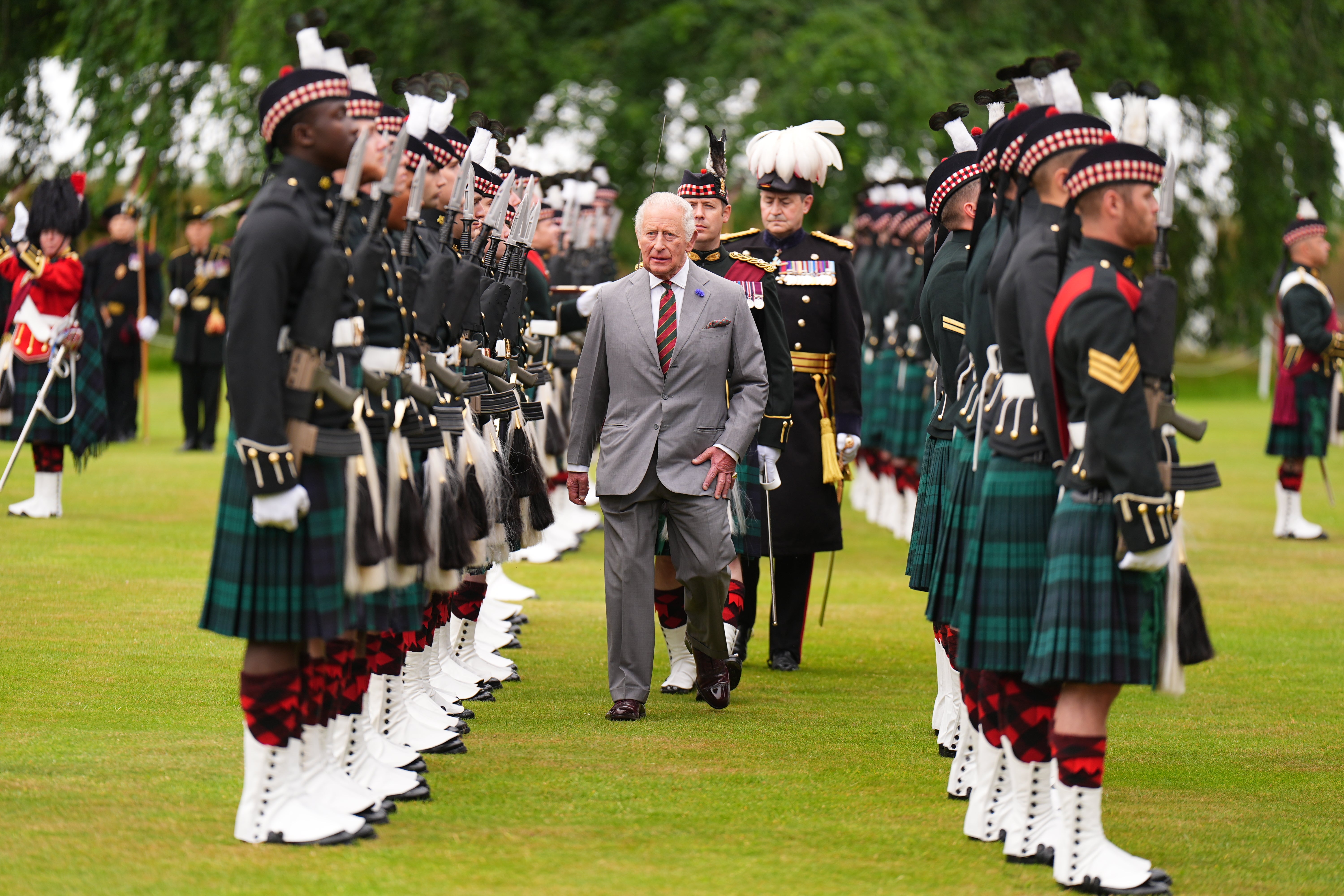 Charles inspects the guard of honour provided by Balaklava Company, 5th Battalion, the Royal Regiment of Scotland (Aaron Chown/PA)