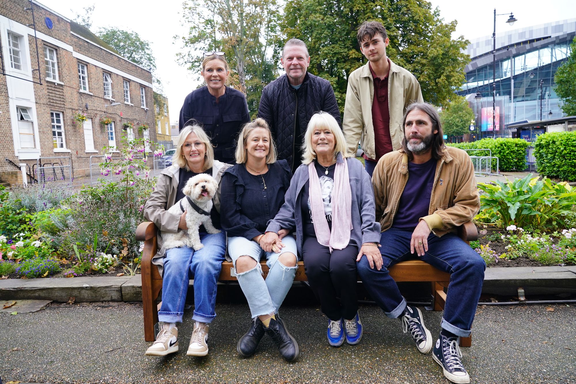 (Back left to right) Michelle Hazard, Micky Hazard and Sonny Millington Flack (front left to right) Liz Gracie holding Lottie the dog, Jody Flack, Christine Flack and Paul Flack at the unveiling a suicide prevention bench in memory of Caroline Flack i