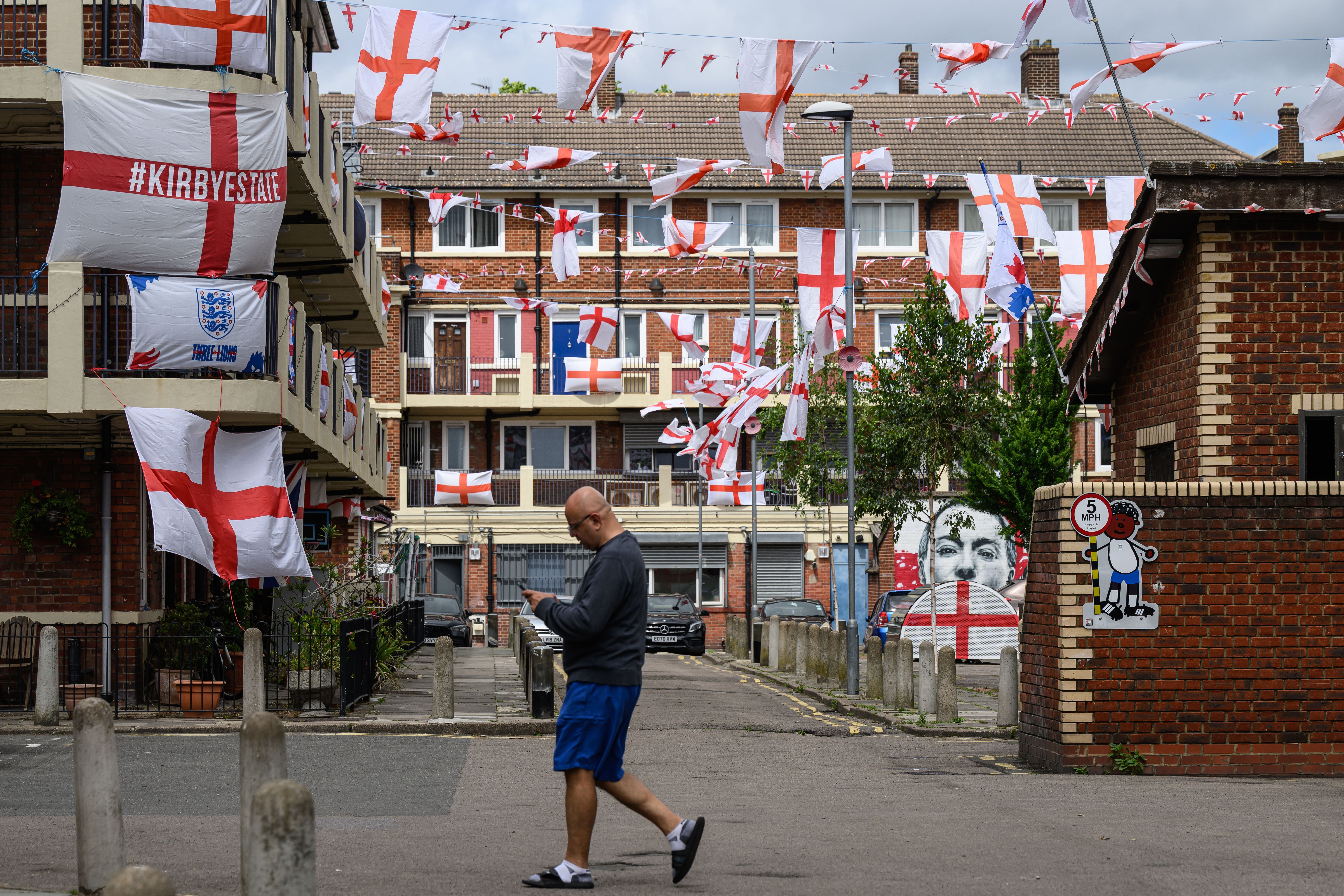 The football-mad Kirby estate decorate their homes with hundreds of flags during each international tournament (Getty)