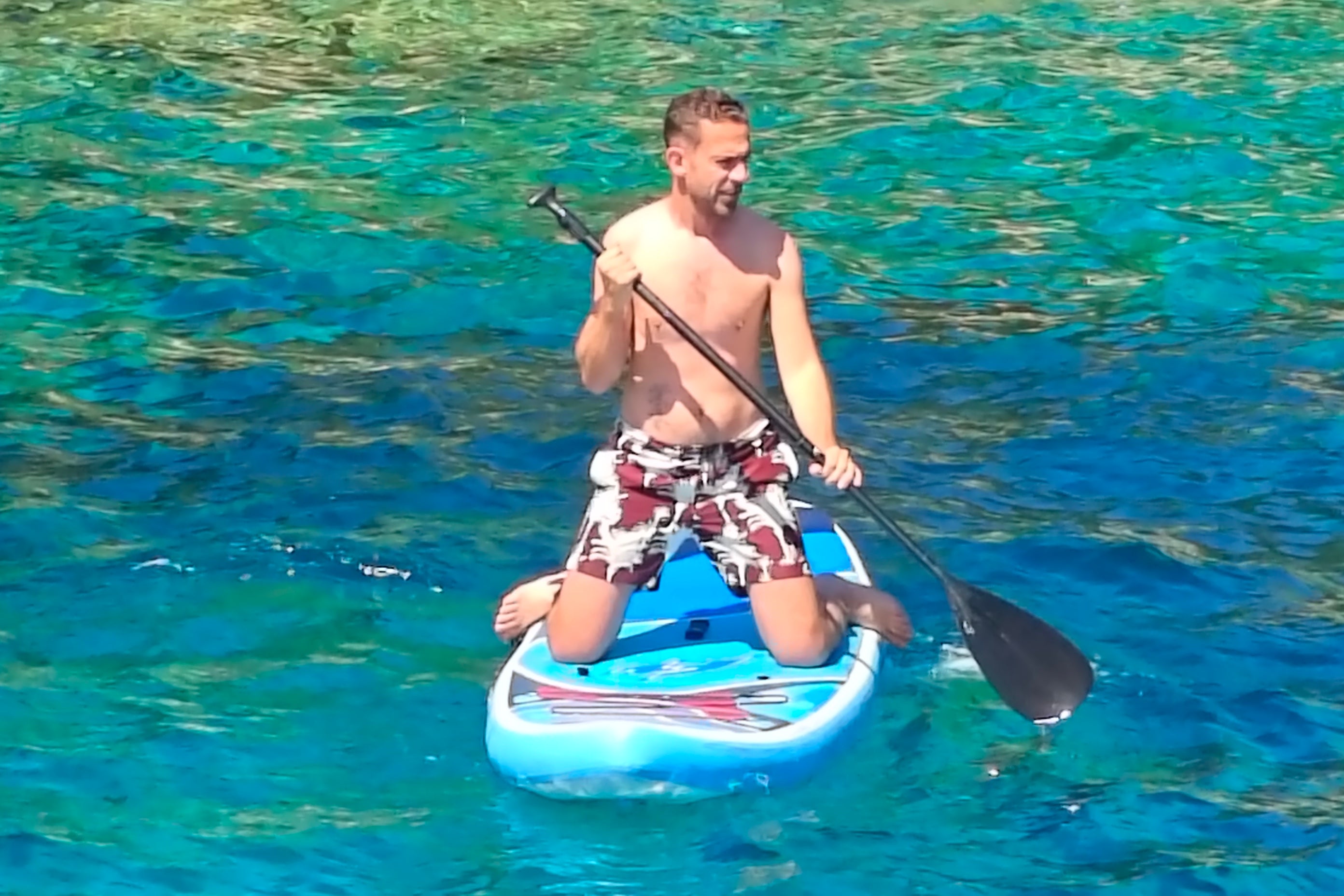Marc Shoffman tries paddleboarding during a regular swim stop (Marc Shoffman)