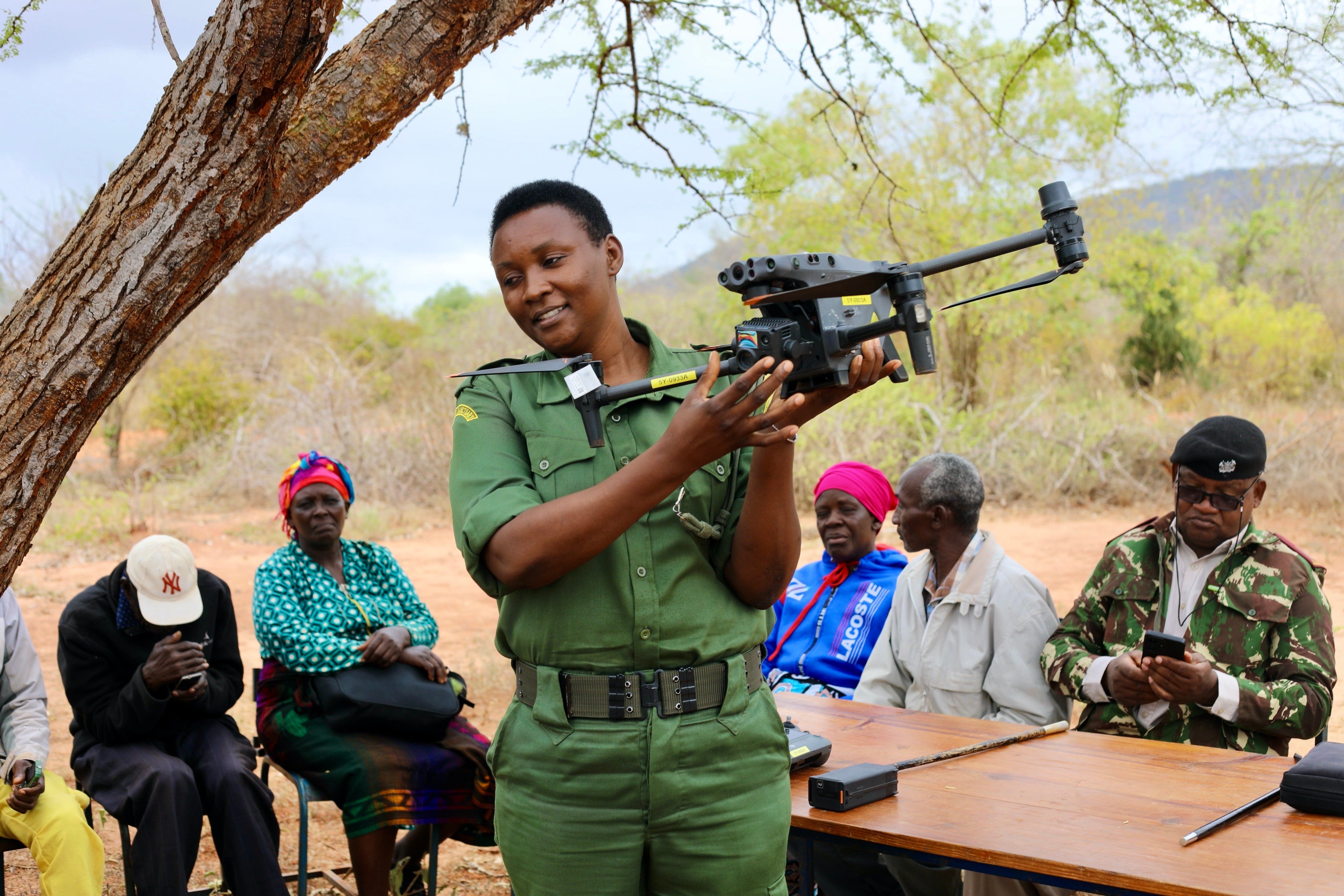 A ranger using a Team Owl Drone to monitor wildlife and spot illegal activity in Kenya