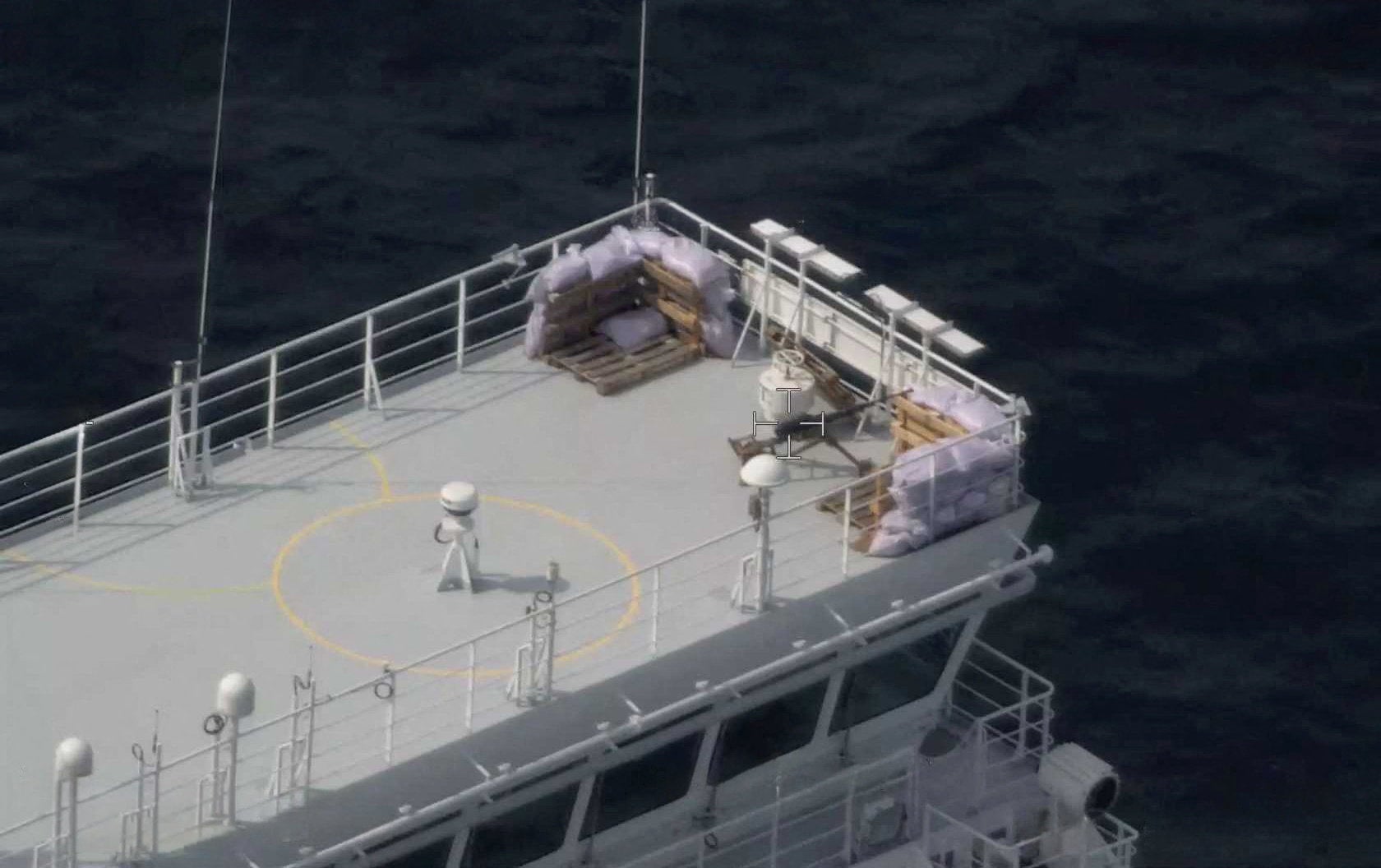 A machine gun on a sandbag-protected post on the civilian Russian-flagged LNG tanker Marshal Vasilevskiy.