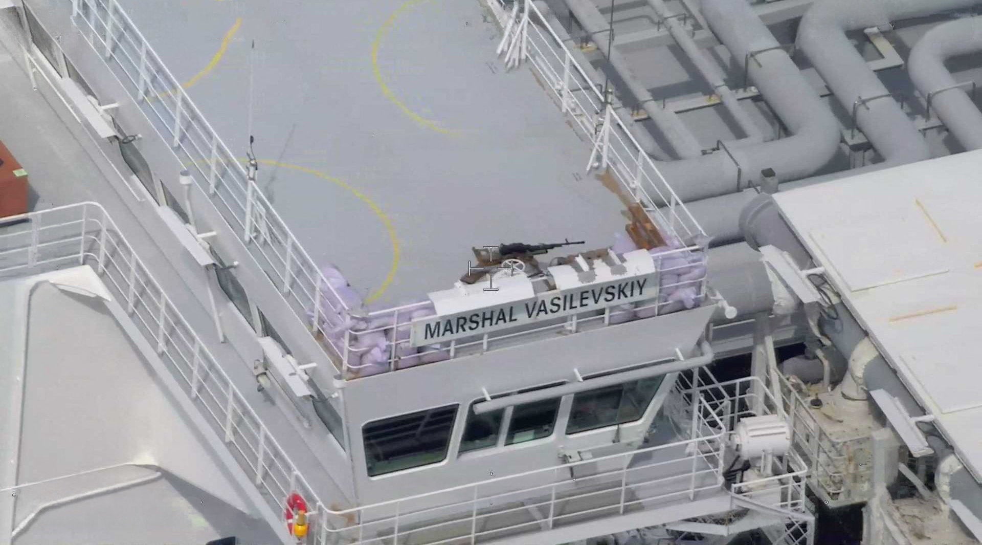 A machine gun on a sandbag-protected post on the civilian Russian-flagged LNG tanker Marshal Vasilevskiy.