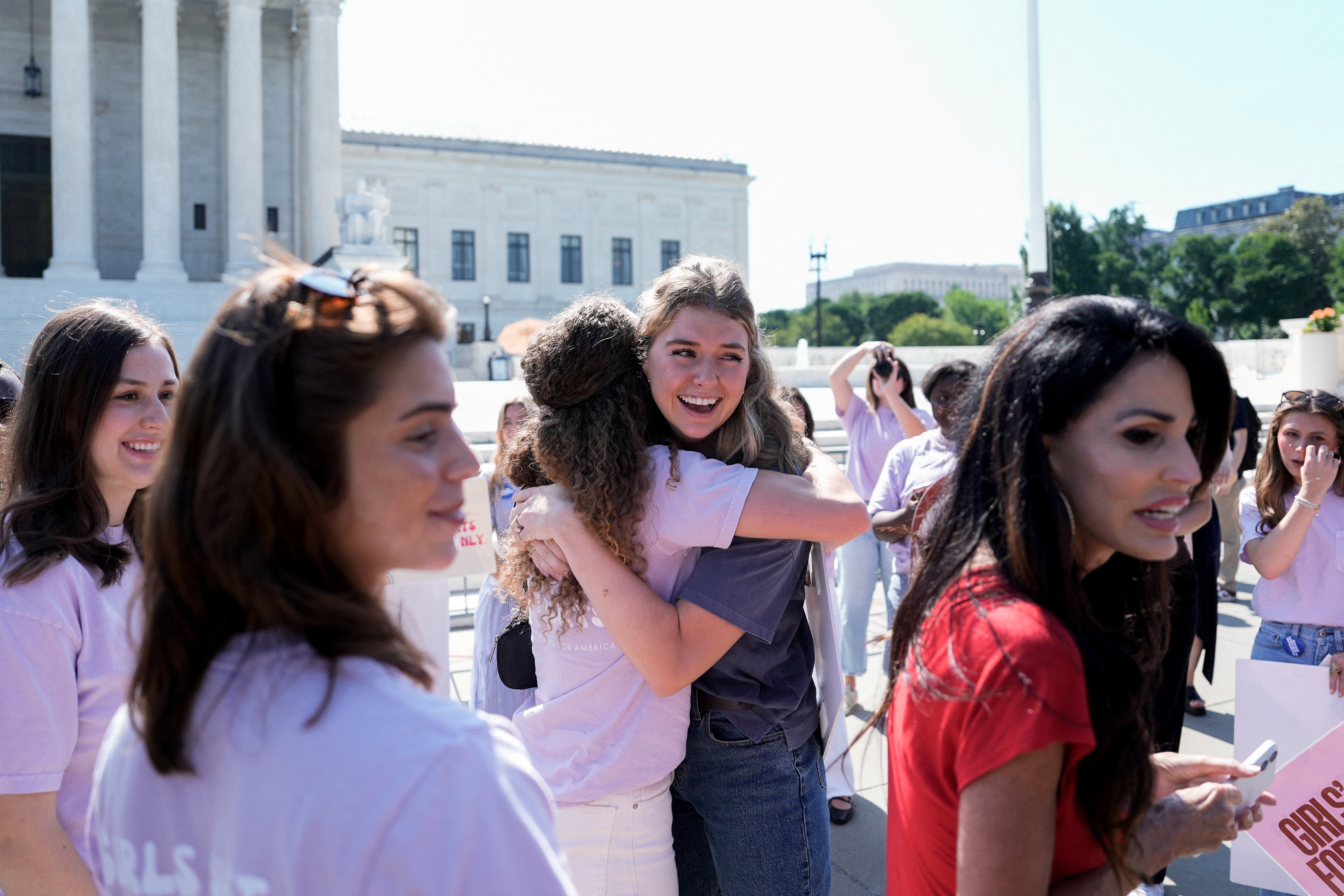 Advocates of banning transgender women and girls from sports celebrate after the Supreme Court ruled in favor of states’ laws (Reuters)