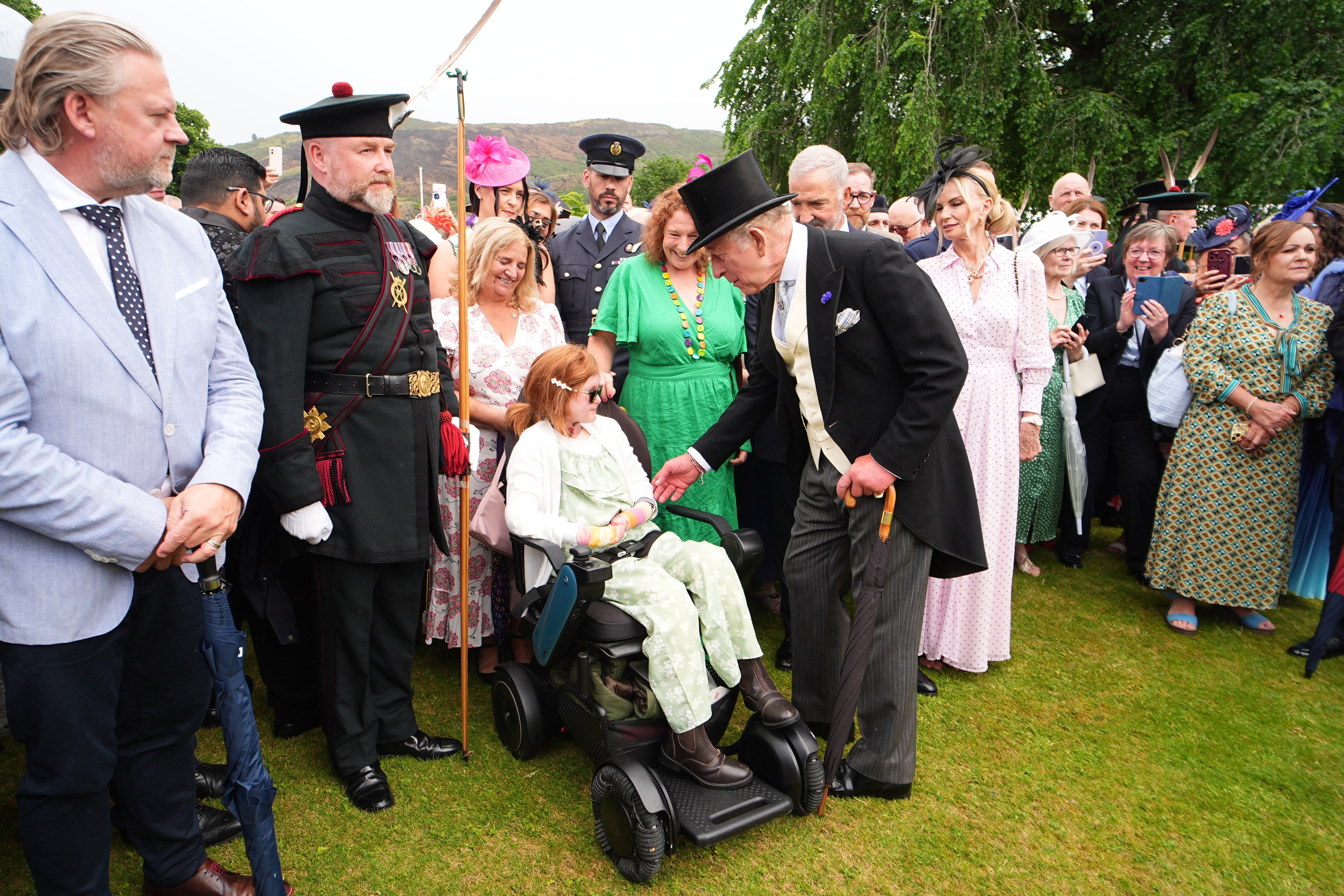 The King spoke to fundraiser Isla Grist in the gardens of the Palace of Holyroodhouse (Aaron Chown/PA) (PA Wire)