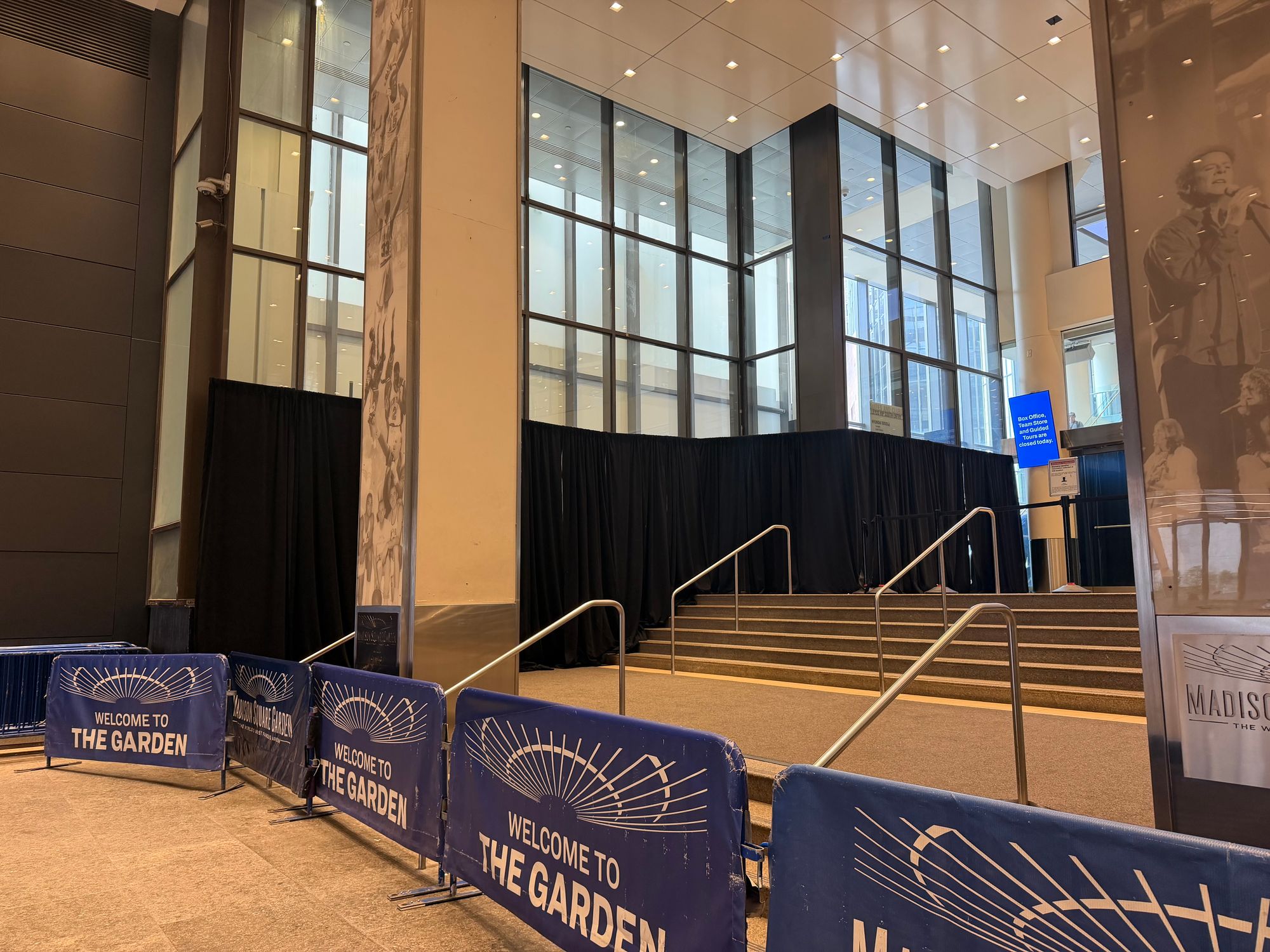 Blackout curtains line the ground-level windows near a now-cordoned-off entrance to Madison Square Garden on Seventh Avenue off W. 33rd Street Tuesday in preparation for the potential wedding of Taylor Swift and Travis Kelce