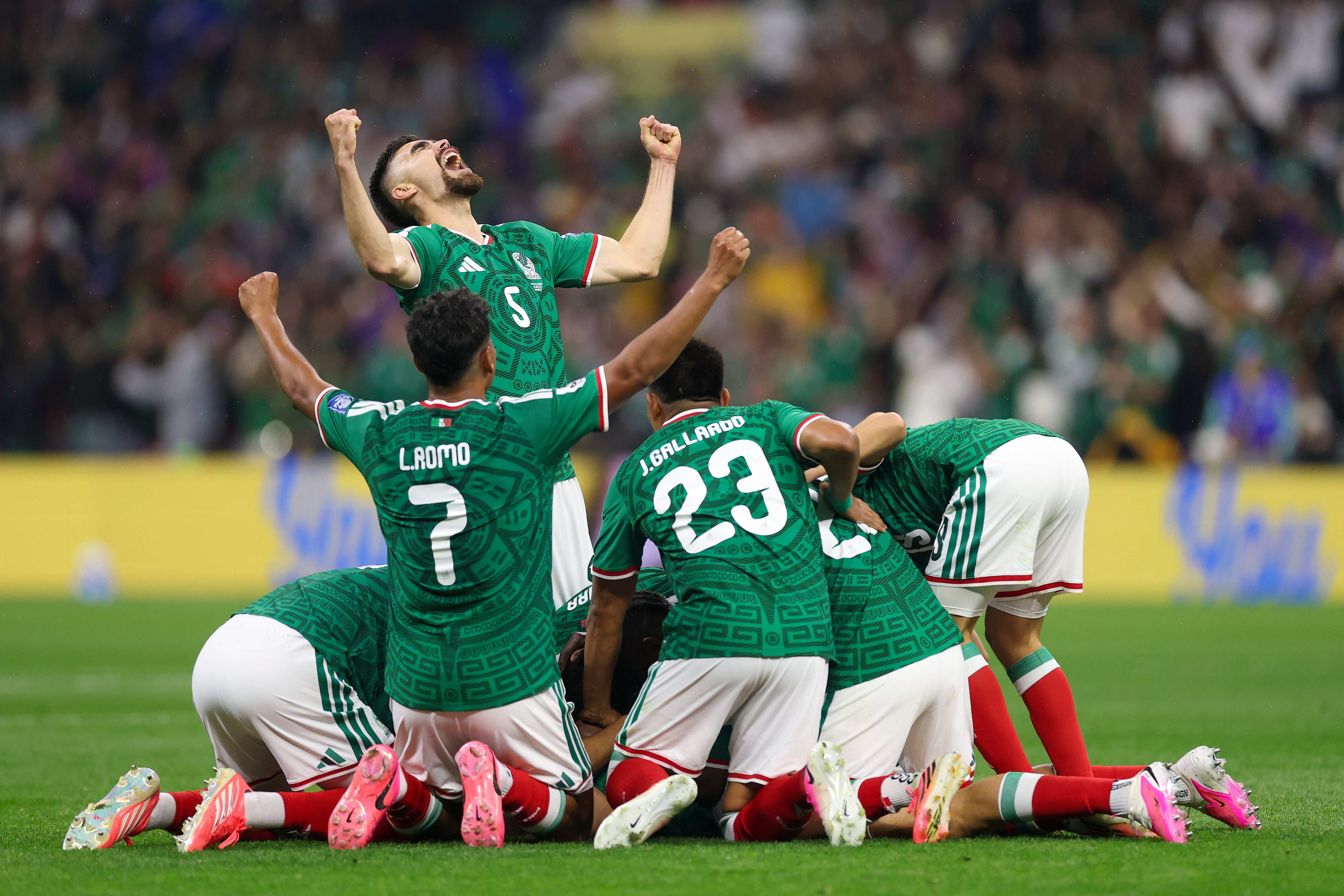 Teamates mobbed Jimenez as he scored Mexico’s second