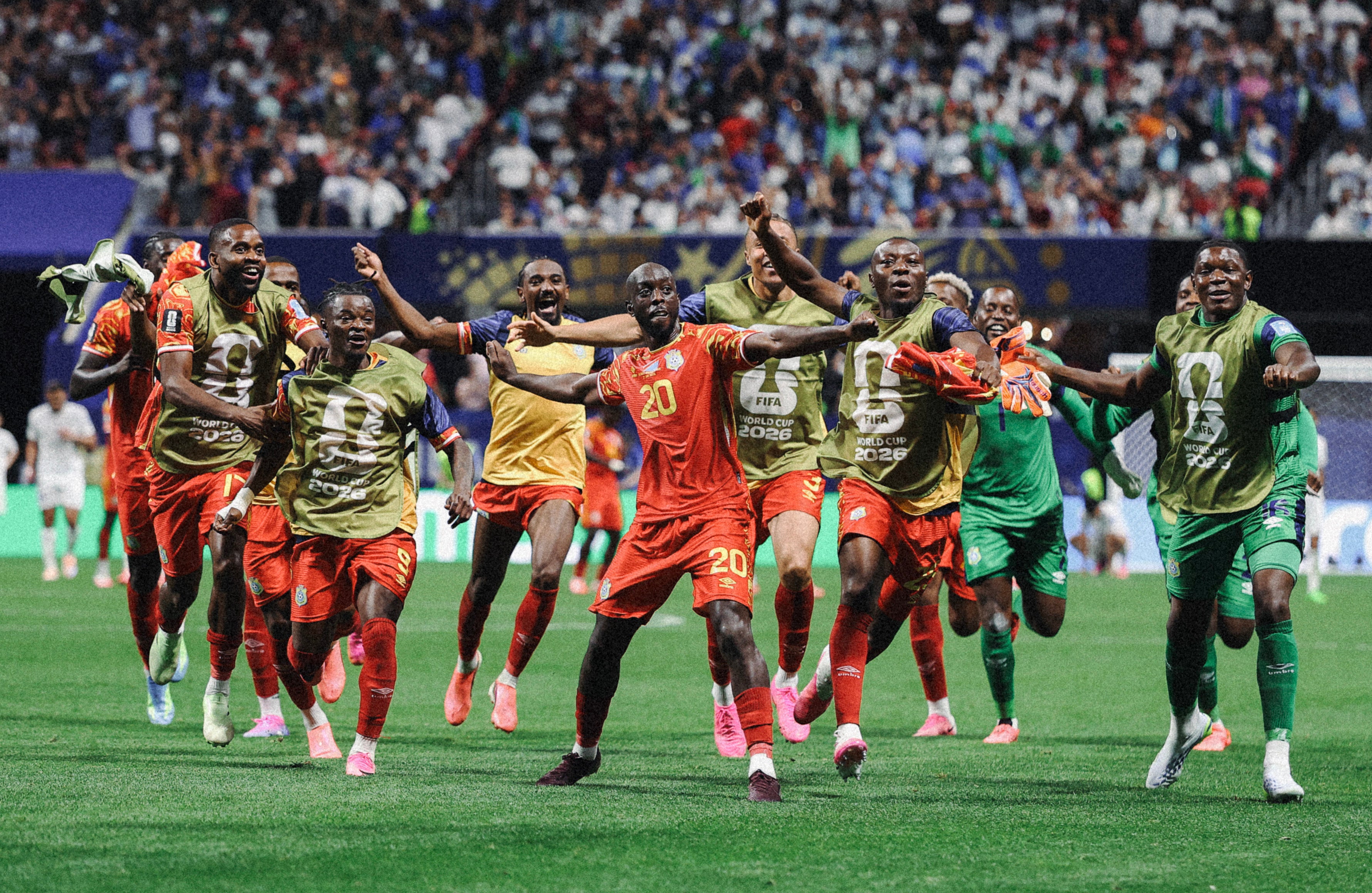 Yoane Wissa celebrates with teammates after scoring the team's third goal against Uzbekistan