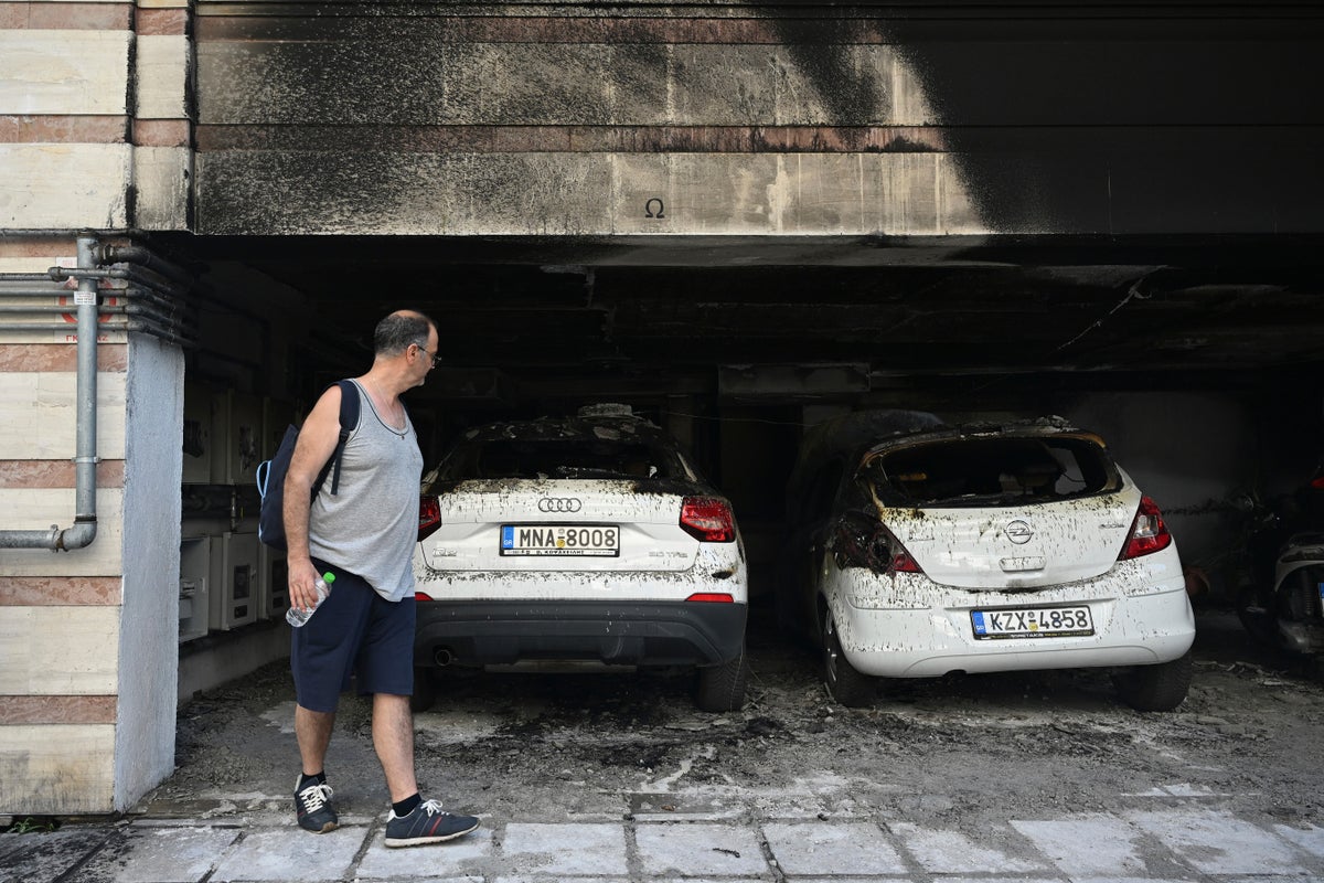 Greek anti-terrorist police arrest 3 for bomb attack that killed politician's mother, injured 4