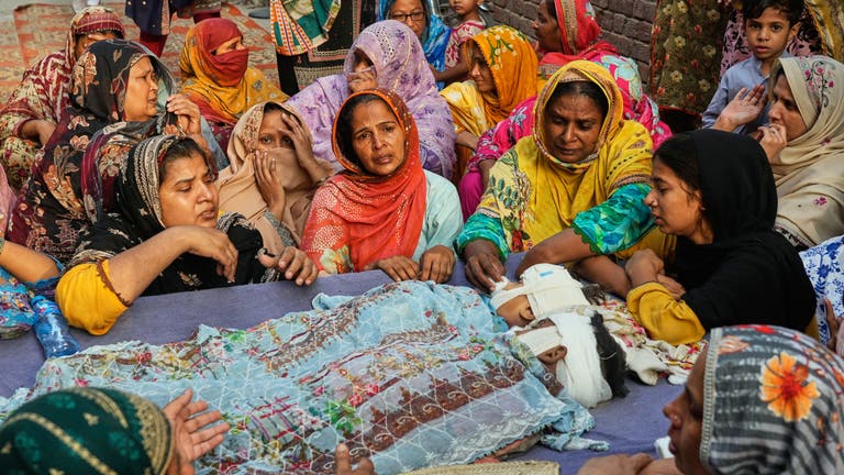 Mourners attend funerals for 14 Pakistani children killed in tutoring ...