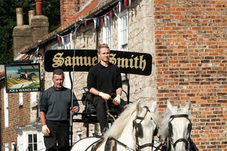 Kegs of beer being delivered to local pubs by carts from the Samuel Smith Old Brewery in Tadcaster