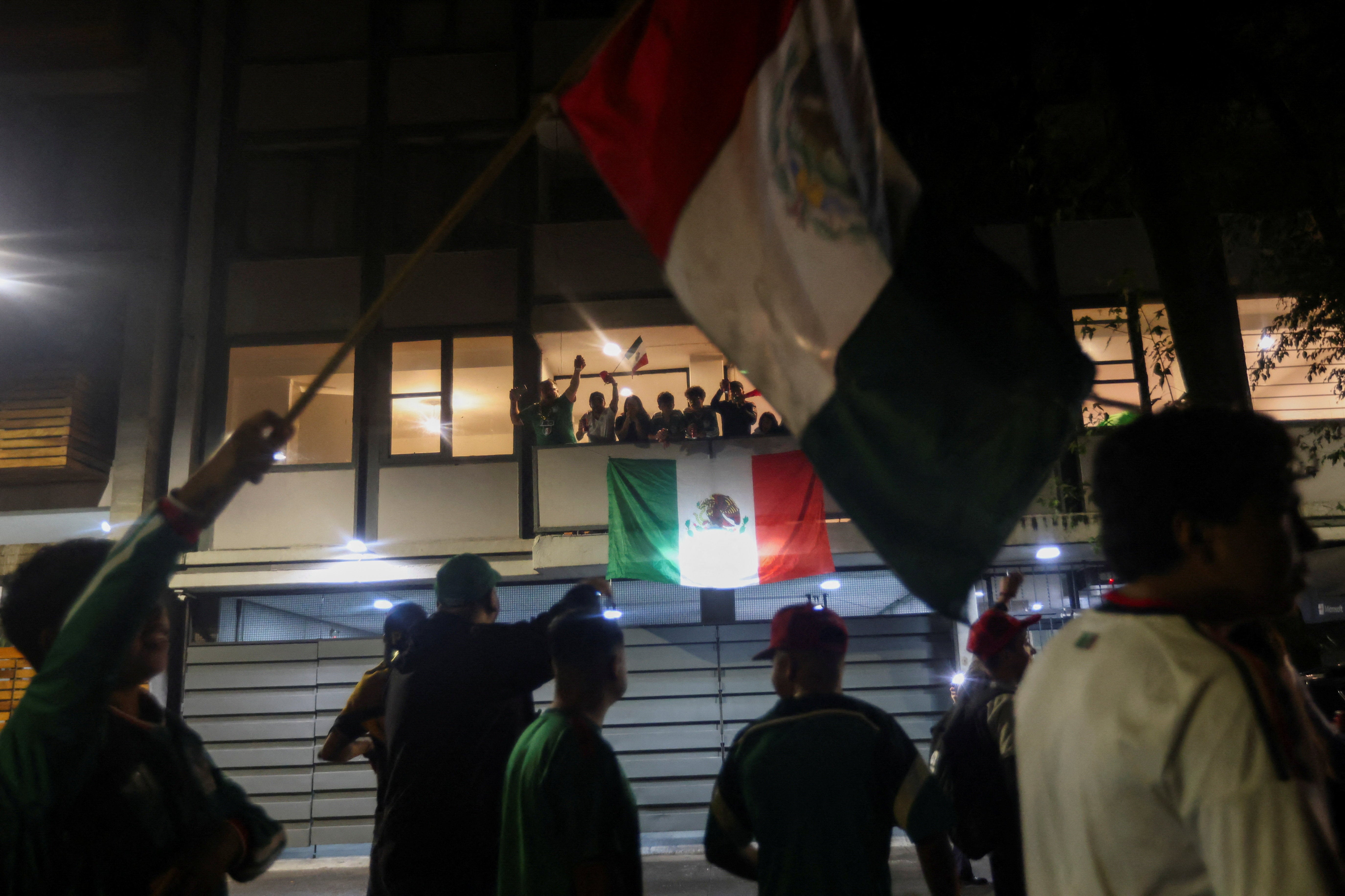 Supporters of Mexico celebrate after Mexico won their game (Reuters)
