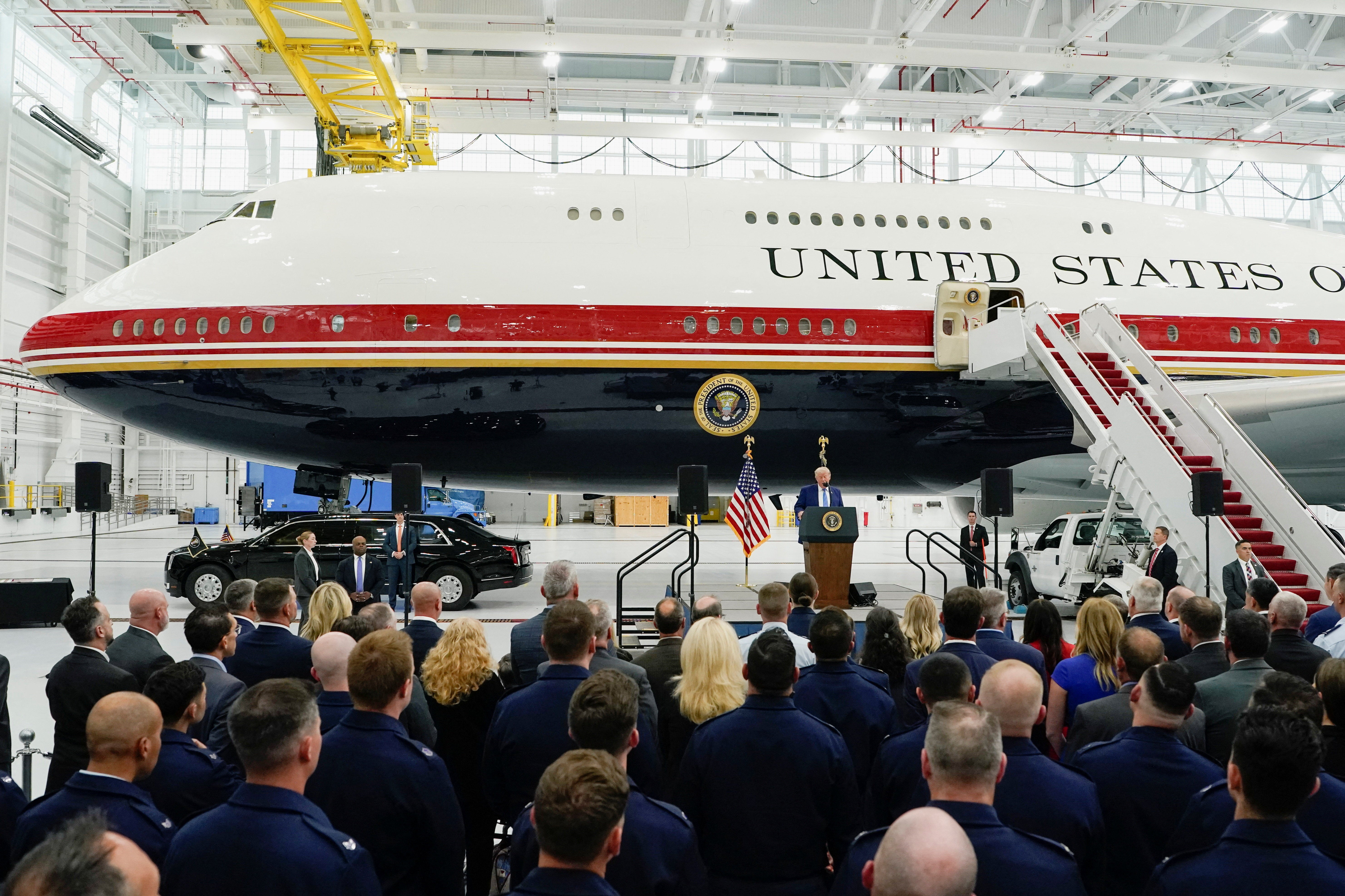 The refurbished aircraft sports a red, white, dark blue and gold paint scheme personally selected by Trump