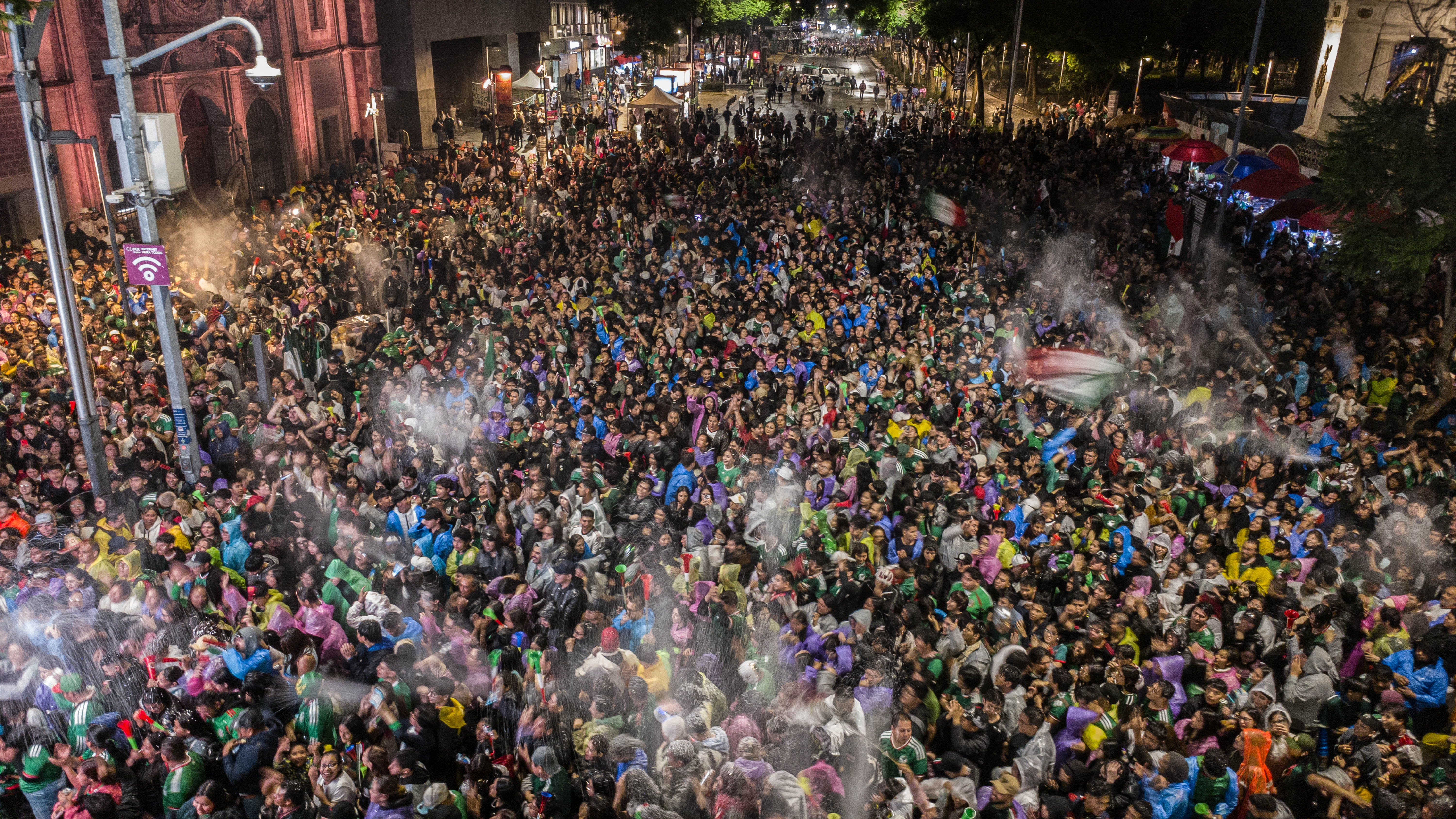 Mexico fans watch on a big screen during the last-32 clash with Ecuador (Getty)