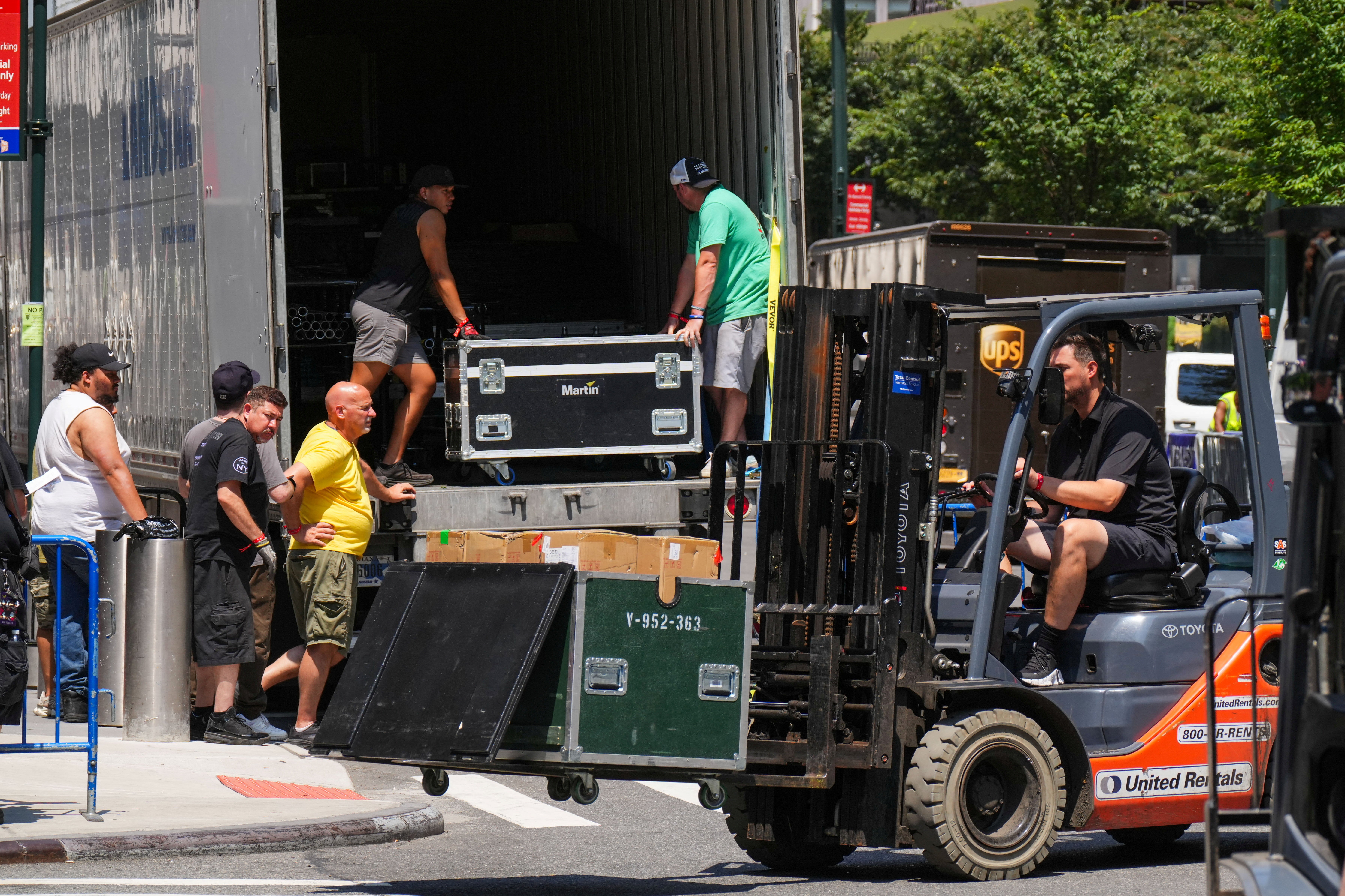 Workers unloaded items from trucks at Madison Square Garden in New York City ahead of Friday's wedding (Reuters)