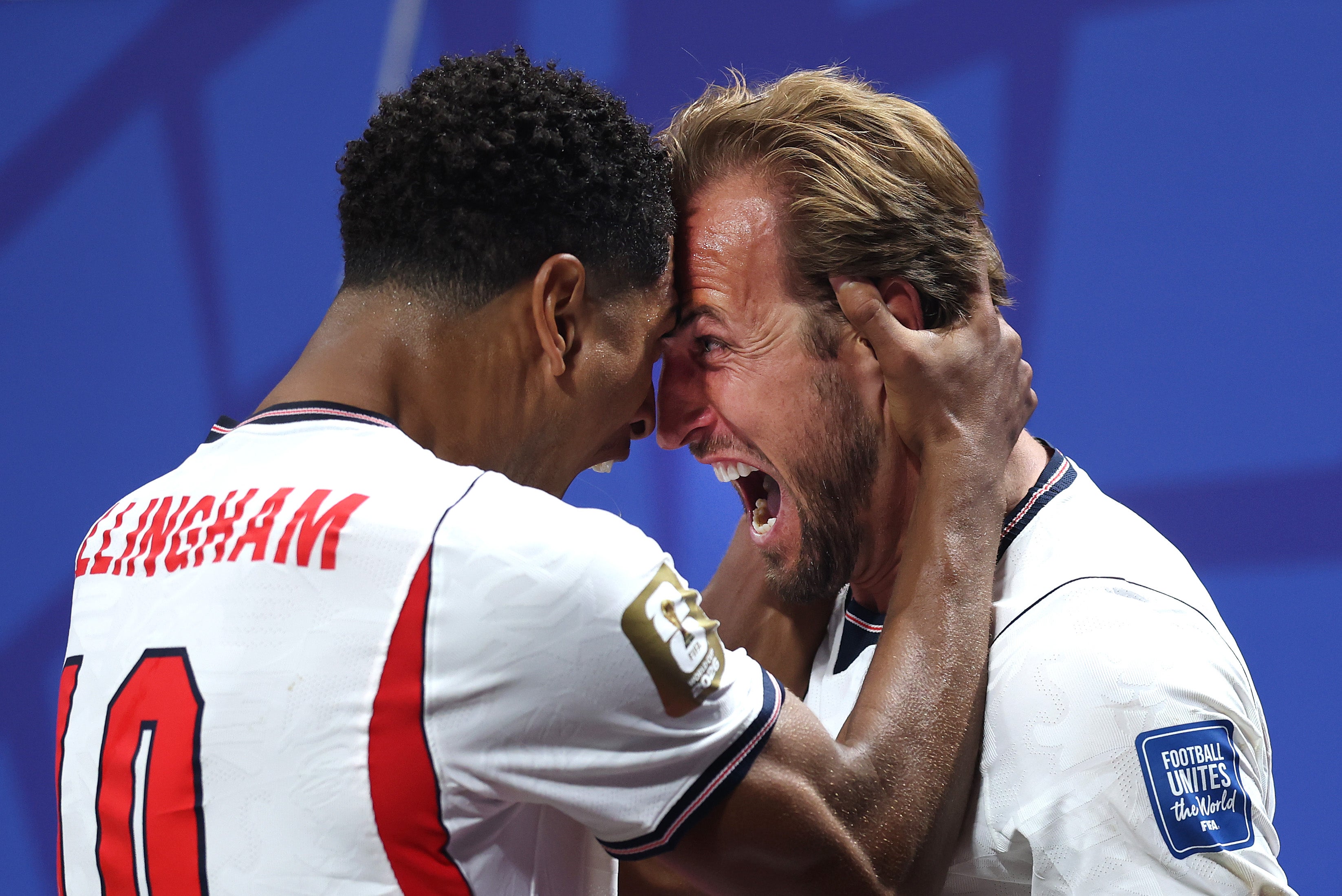 Harry Kane of England celebrates with teammate Jude Bellingham after scoring his team's first goal (Getty)