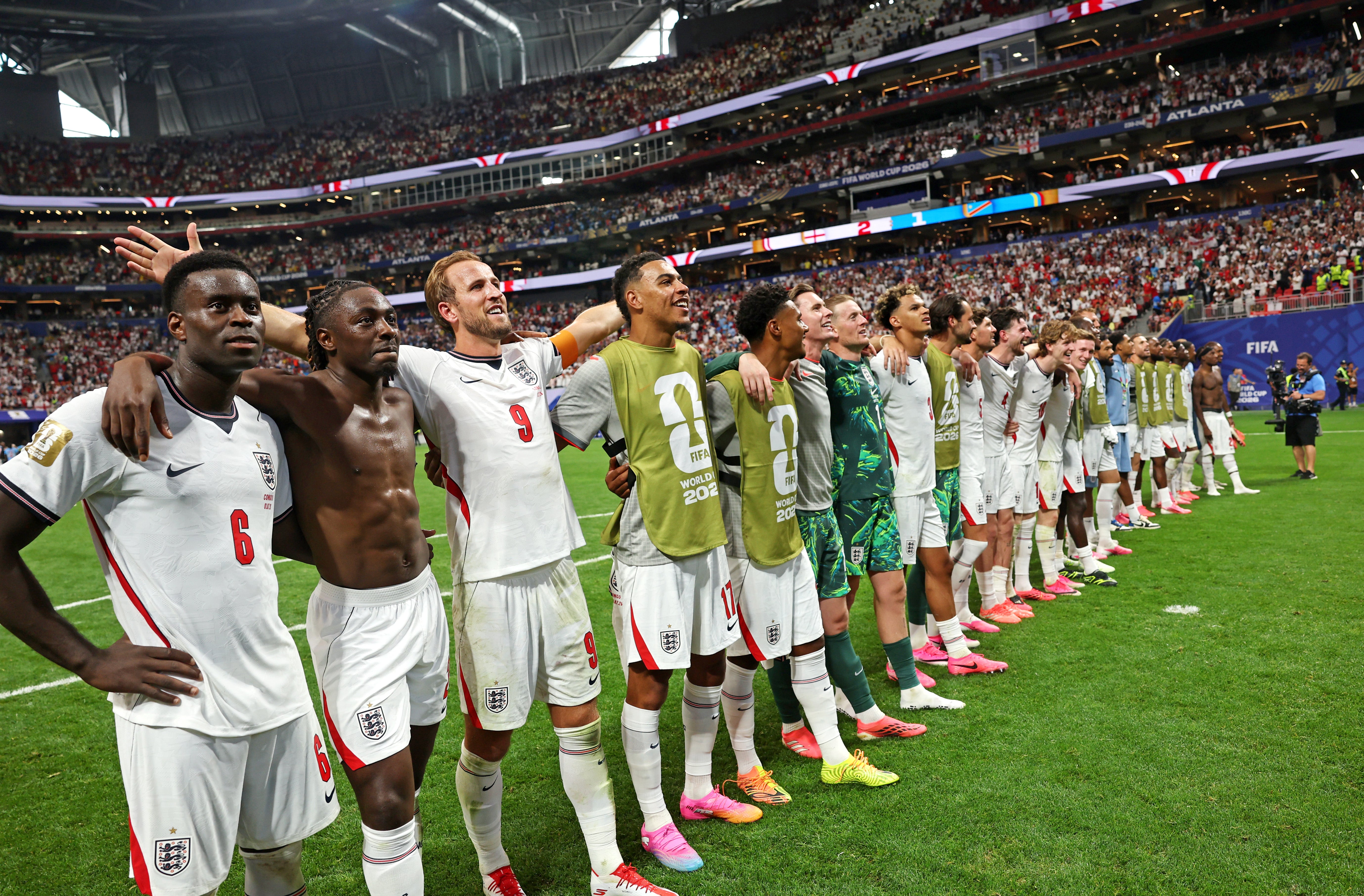 Players of England celebrate after the team's victory and progression to the Round of 16