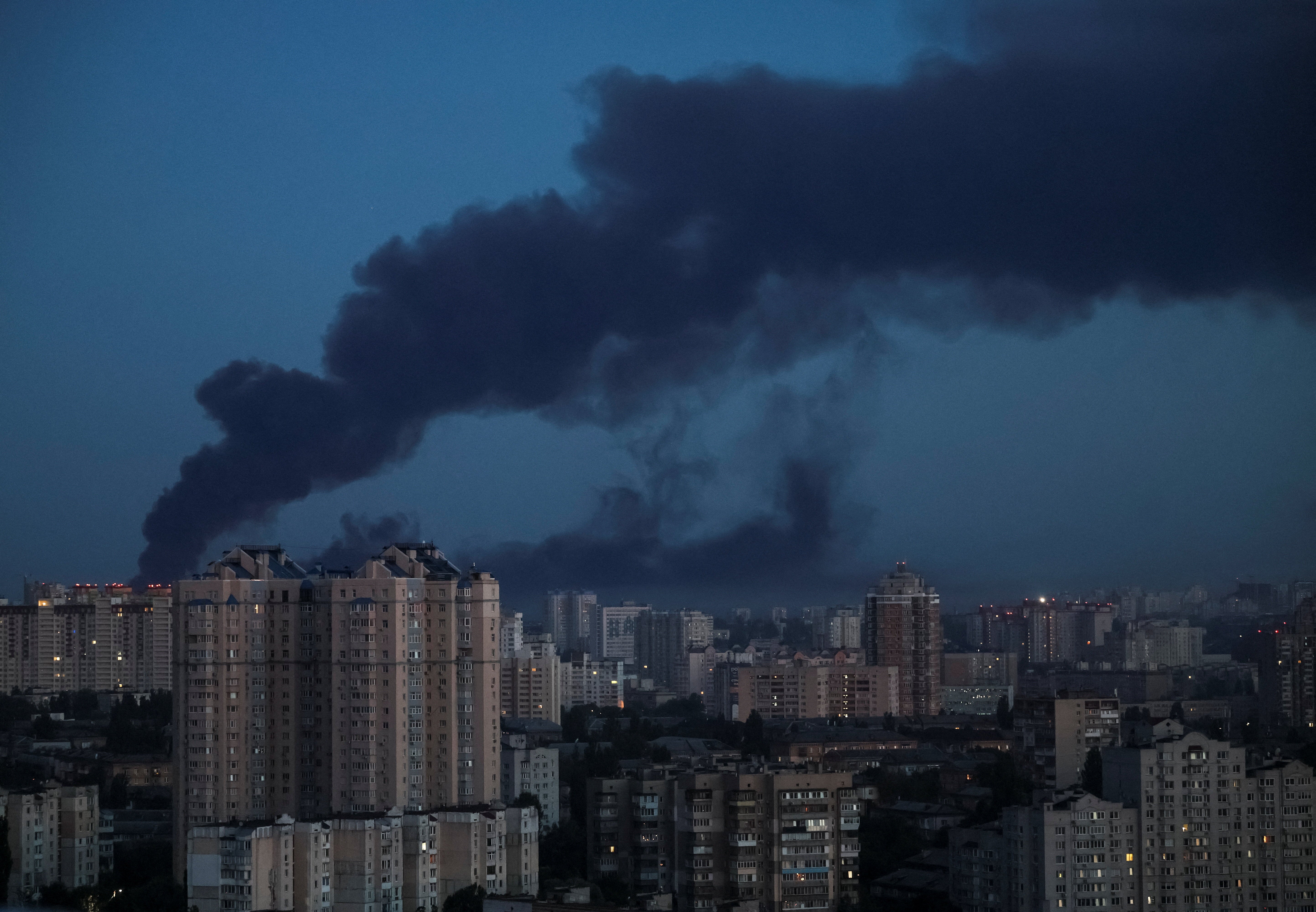 Buildings in Kyiv seen on fire as smoke billows from residential area
