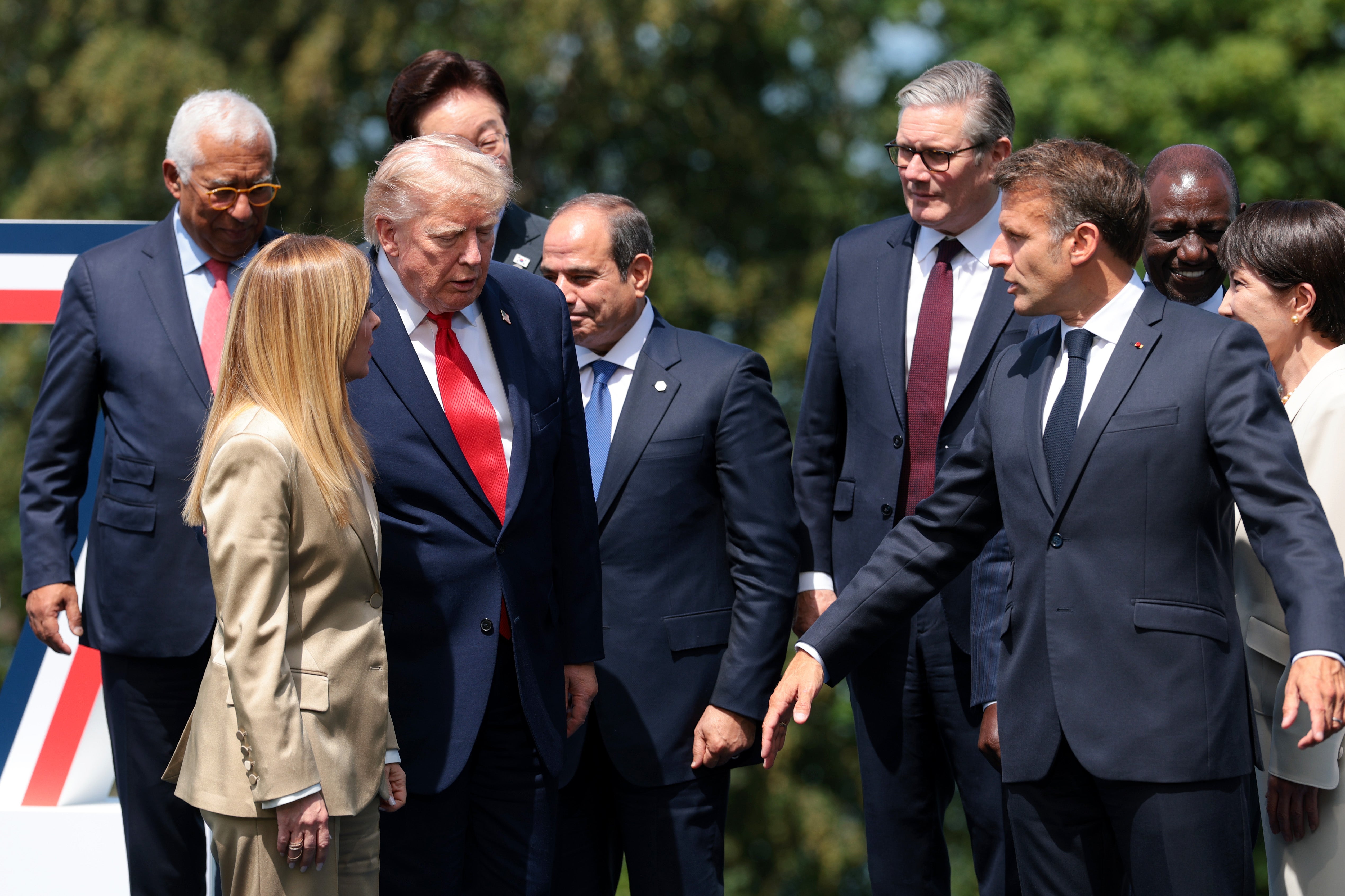 European Council President Antonio Costa, Italy's Prime Minister Giorgia Meloni, U.S. President Donald Trump, Egypt's President Abdel Fattah El-Sisi, Britain's Prime Minister Keir Starmer and France's President Emmanuel Macron talk after a family photo during the G7 Summit on June 16, 2026 in Evian-les-Bains, France