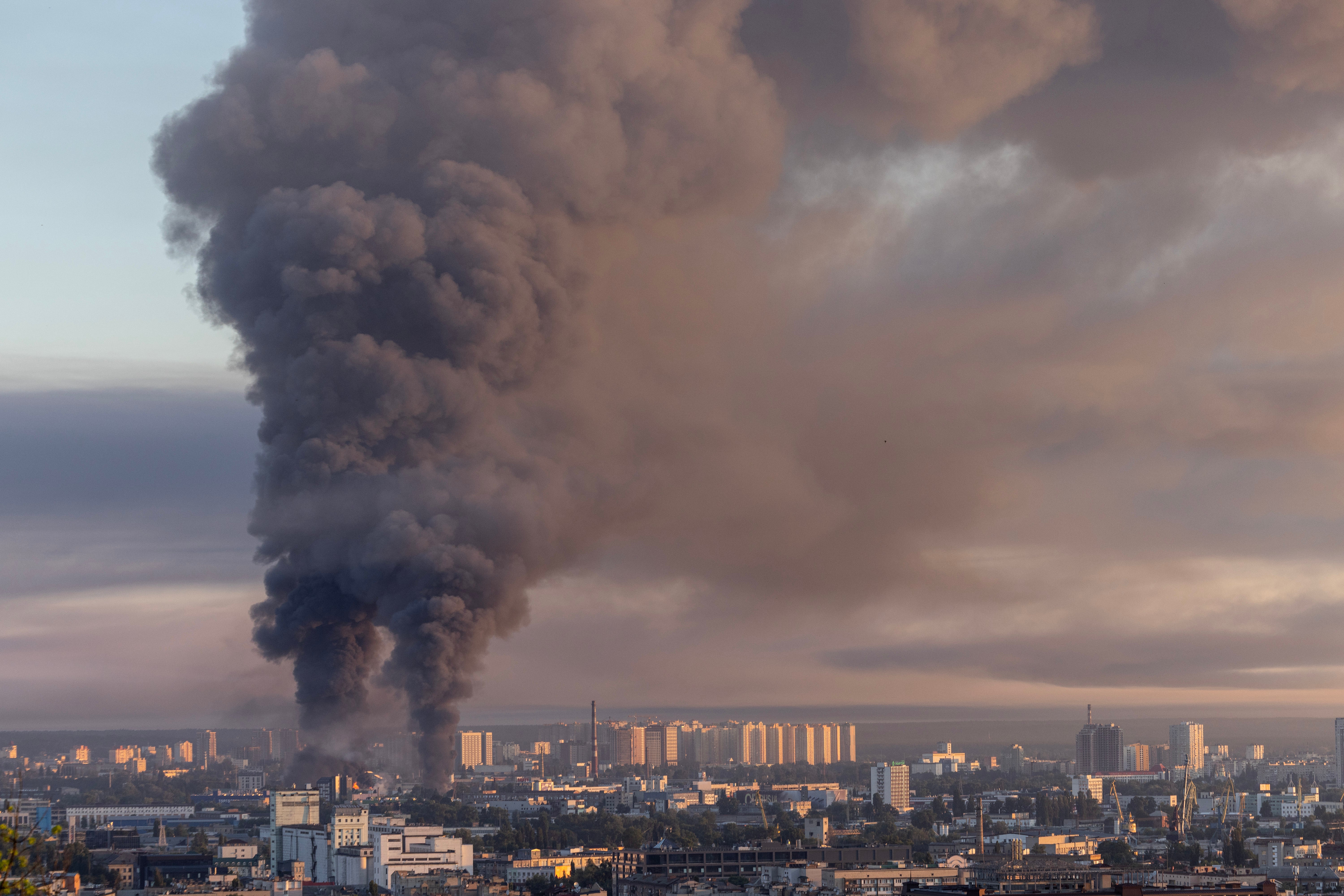 Smoke is seen as two major fires burn after a drone and missile attack by Russian forces on 2 July