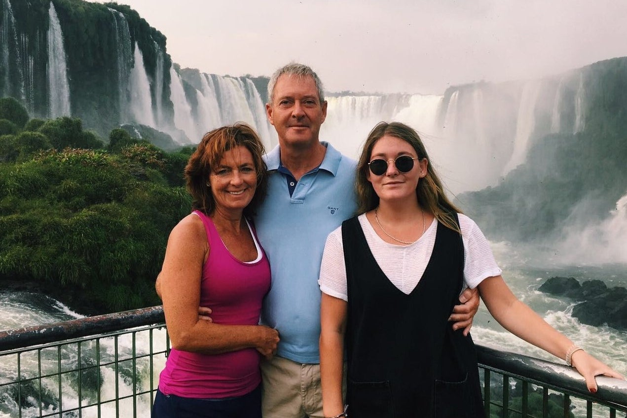 Emily Oliver, who died from DIGP, with her parents Debi and Tim (Family handout)