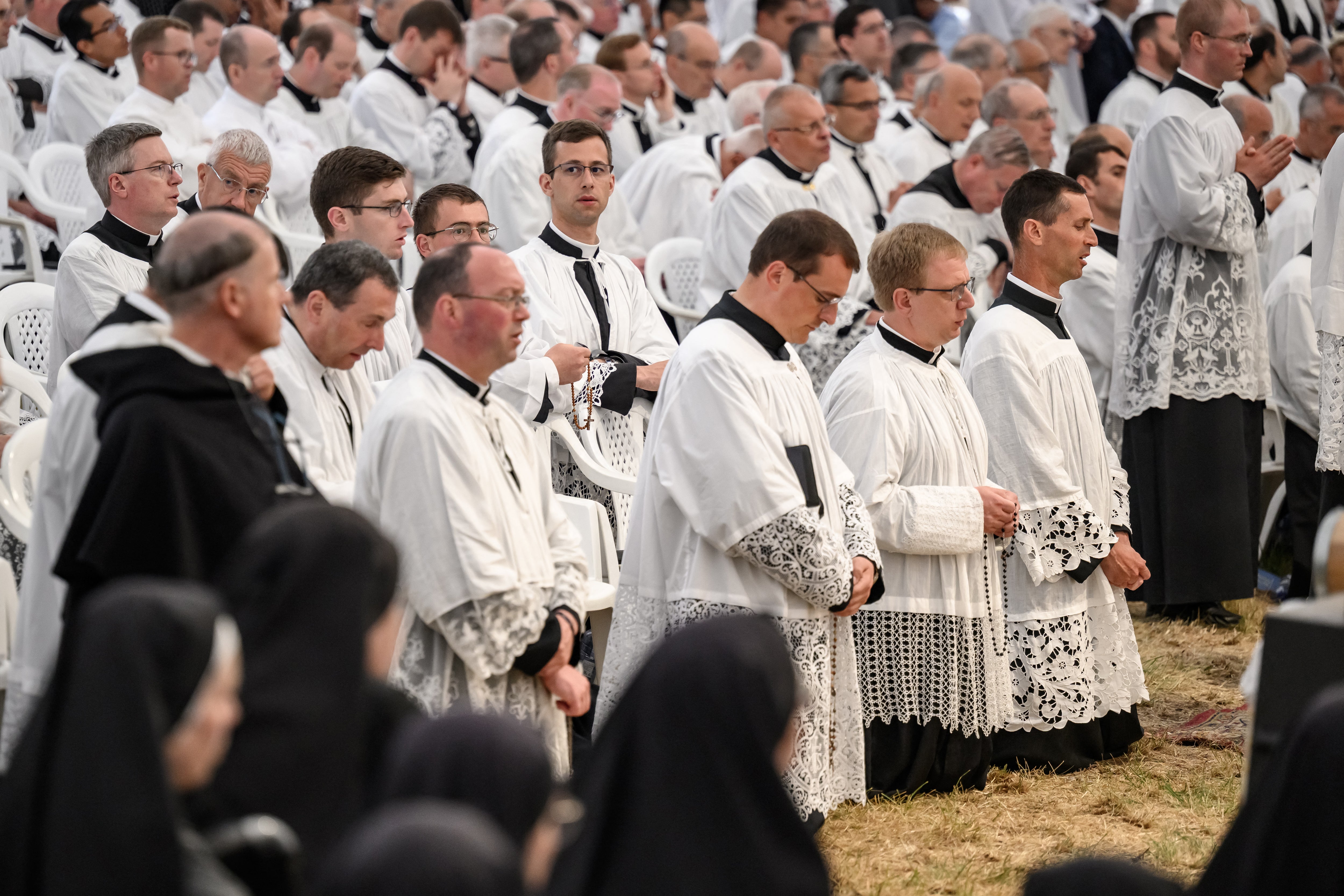 Priests attend the schismatic consecration of bishops by the traditionalist Catholic Society of Saint Pius X (SSPX) in Econe, western Switzerland