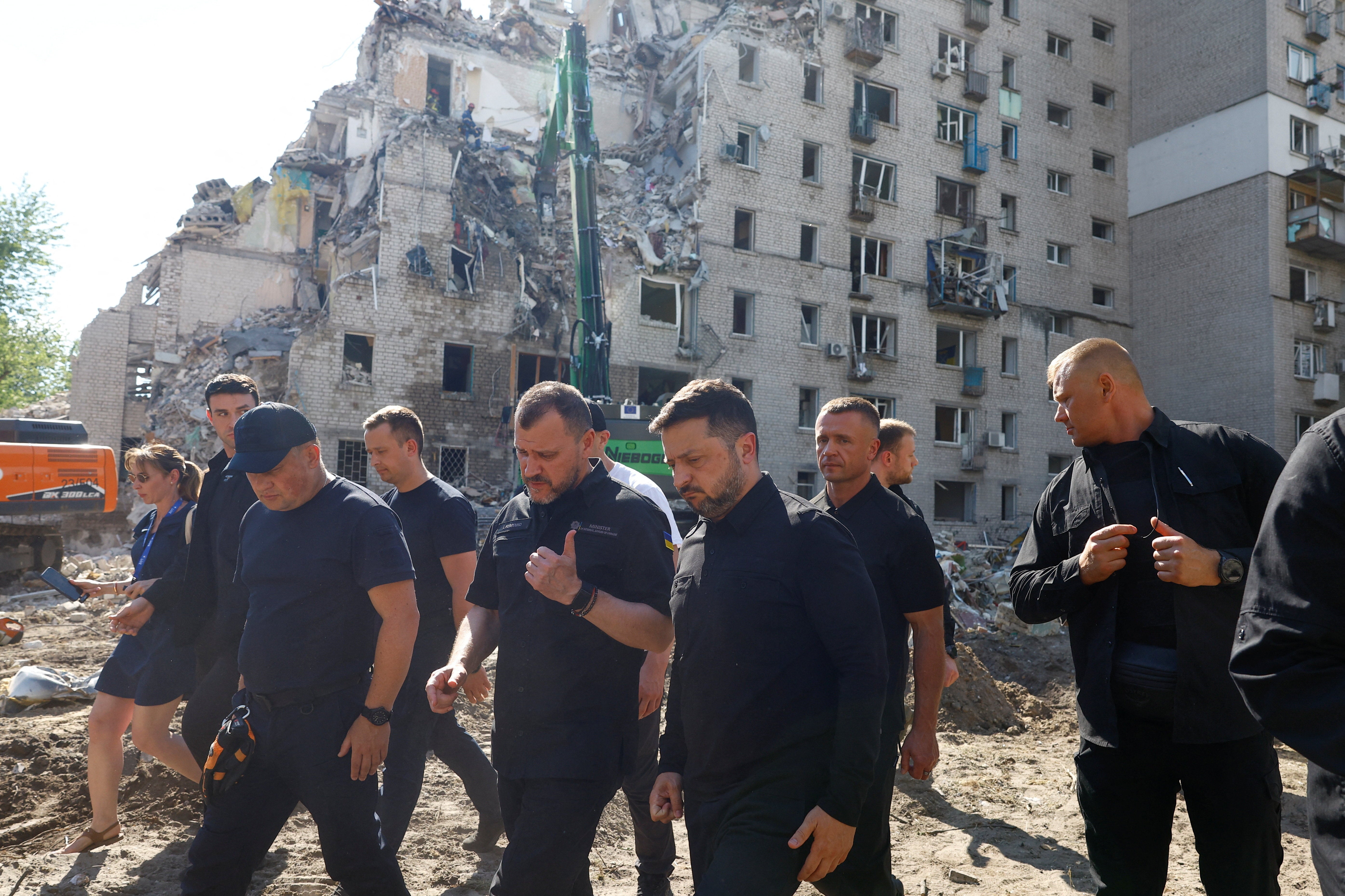 Volodymyr Zelensky walks through Kyiv with interior minister Ihor Klymenko as he surveys the damage