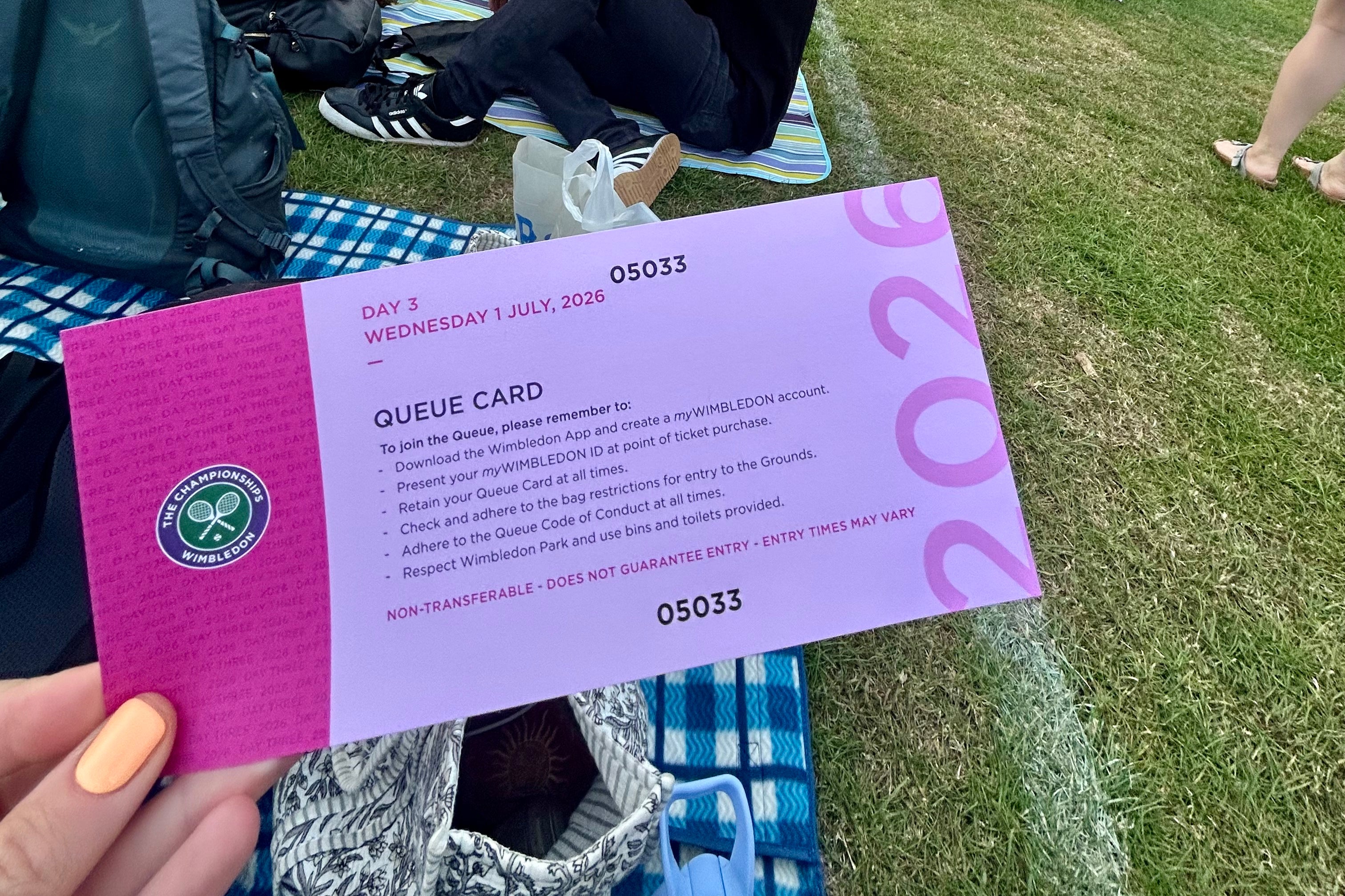 Queue cards ensure that no one loses their place before reaching the Wimbledon gates (Katie Strick)
