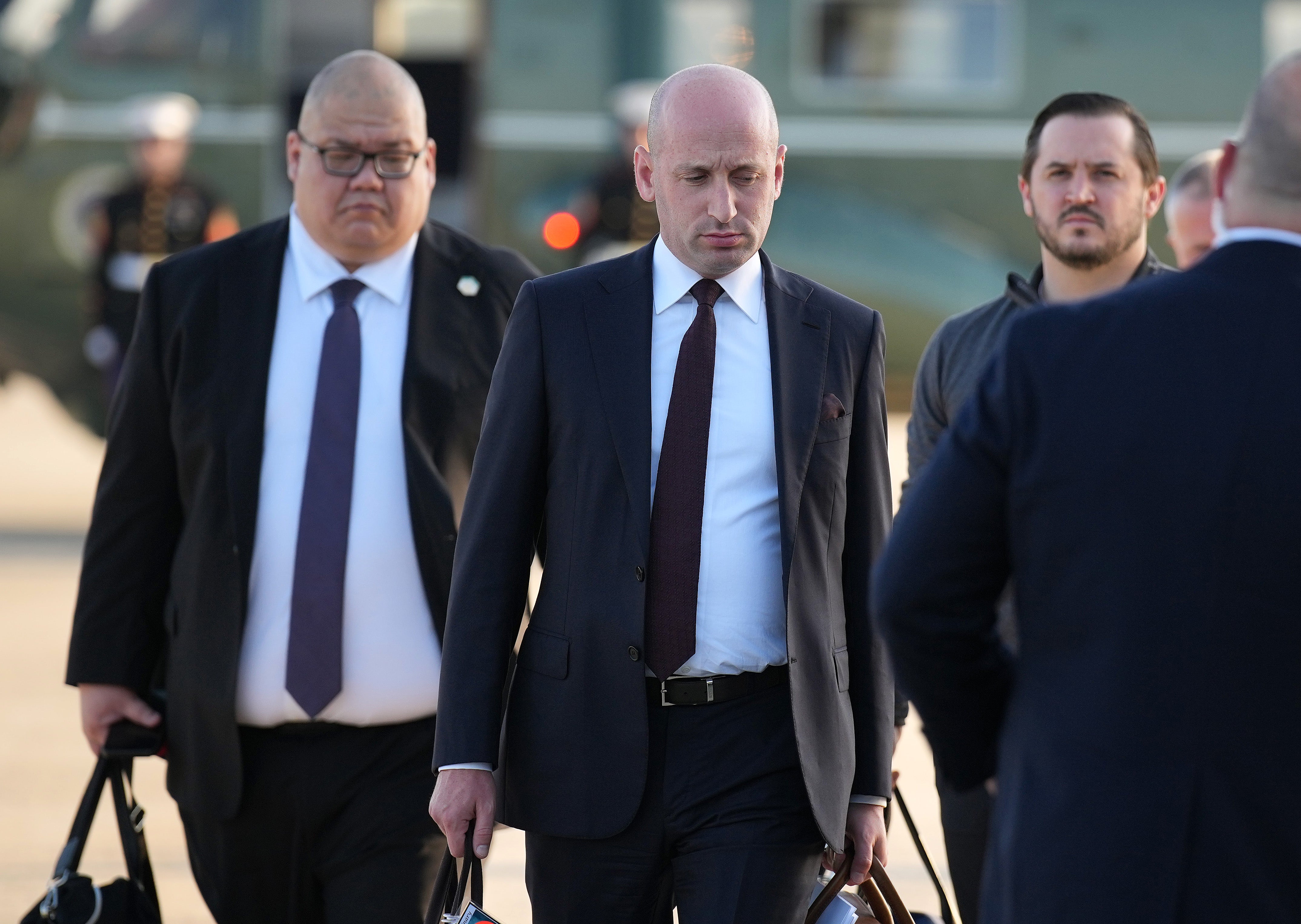 White House Communications Director Steven Cheung (left) and Deputy Chief of Staff Stephen Miller (right) each drew salaries of $195,200, according to the report (Getty)