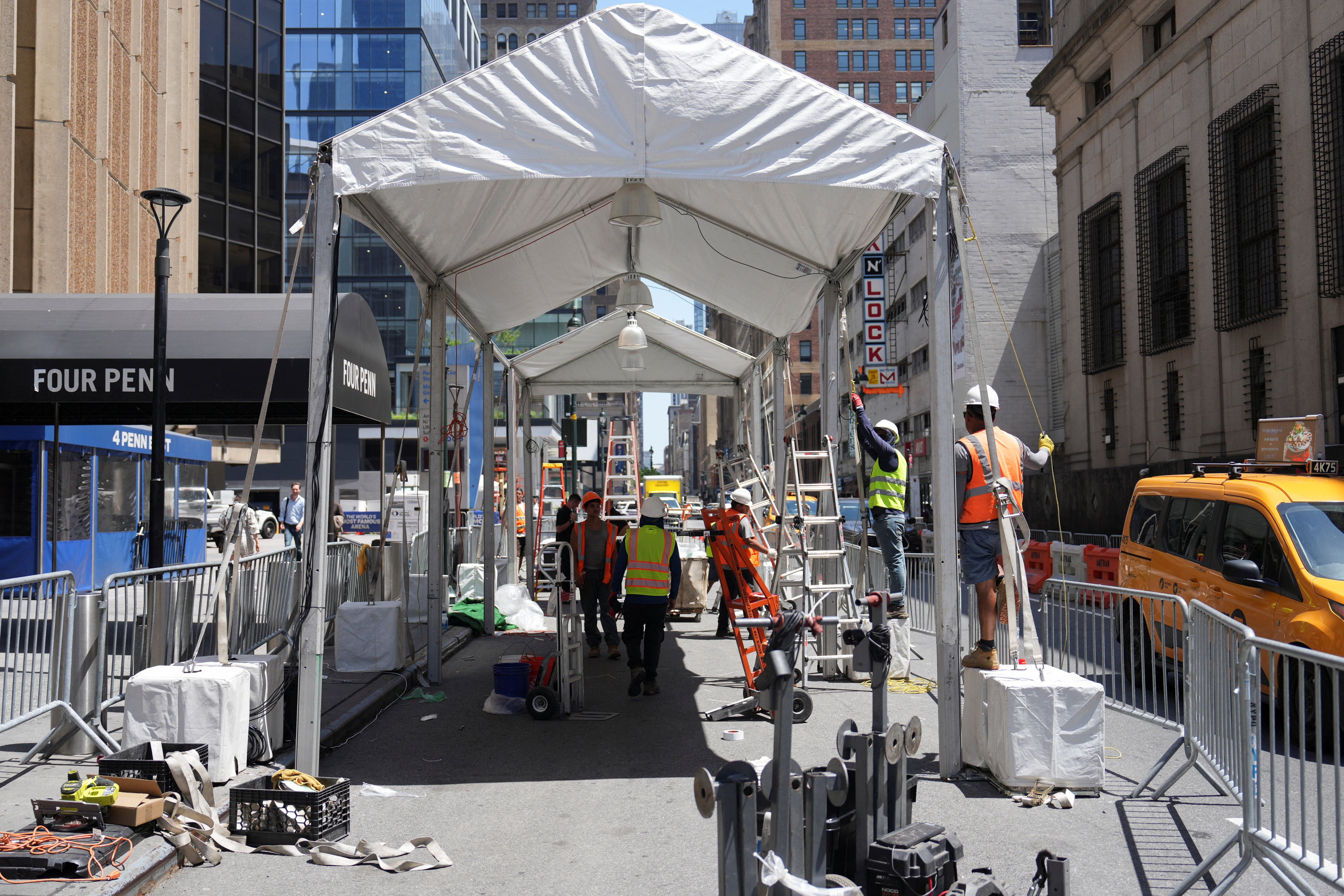 Workers set up tents outside Madison Square Garden Thursday