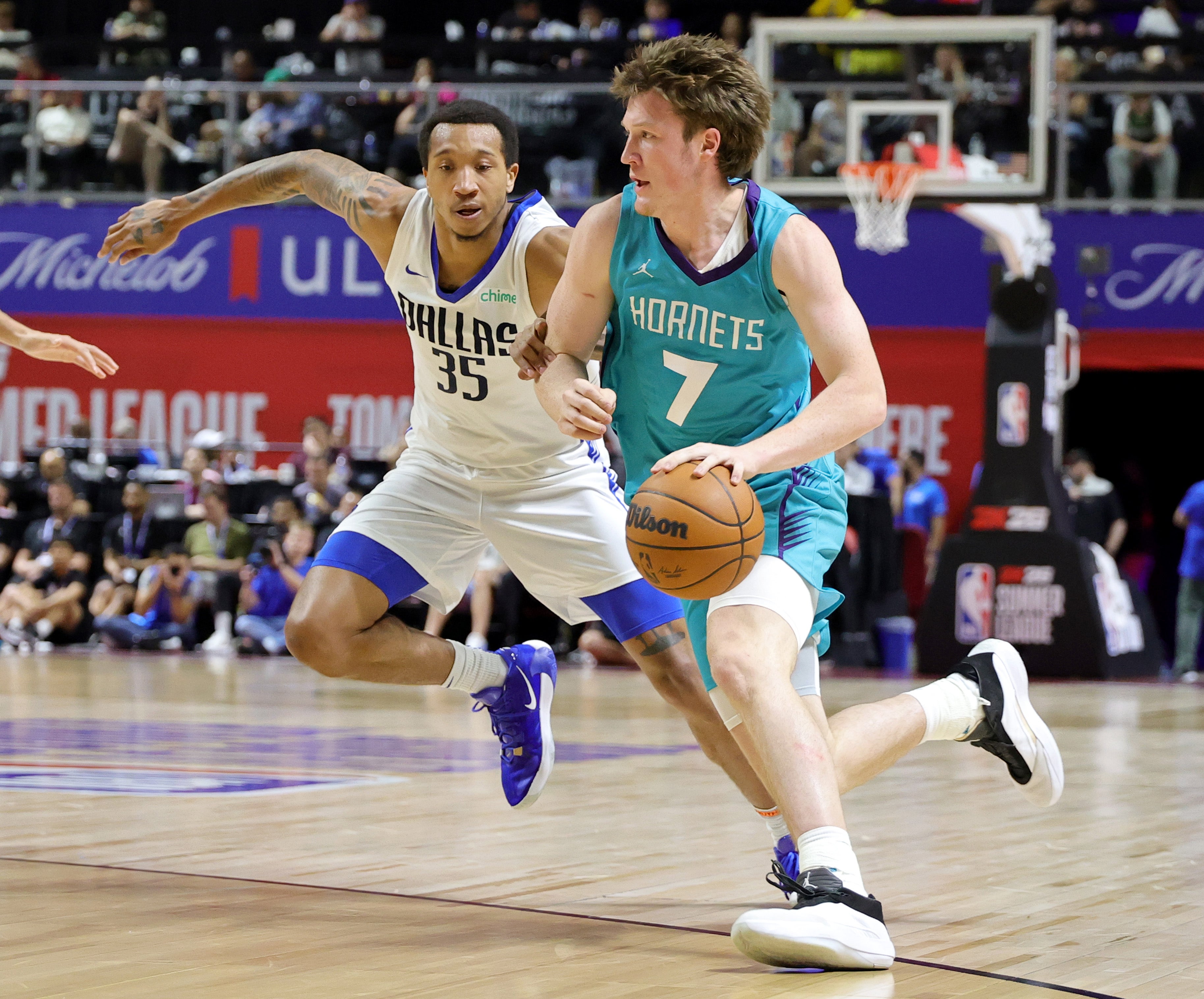 Kon Knueppel #7 of the Charlotte Hornets drives against Matthew Cleveland #35 of the Dallas Mavericks in the first half of a 2025 NBA Summer League game at the Thomas & Mack Center on July 14, 2025 in Las Vegas, Nevada (Getty Images)