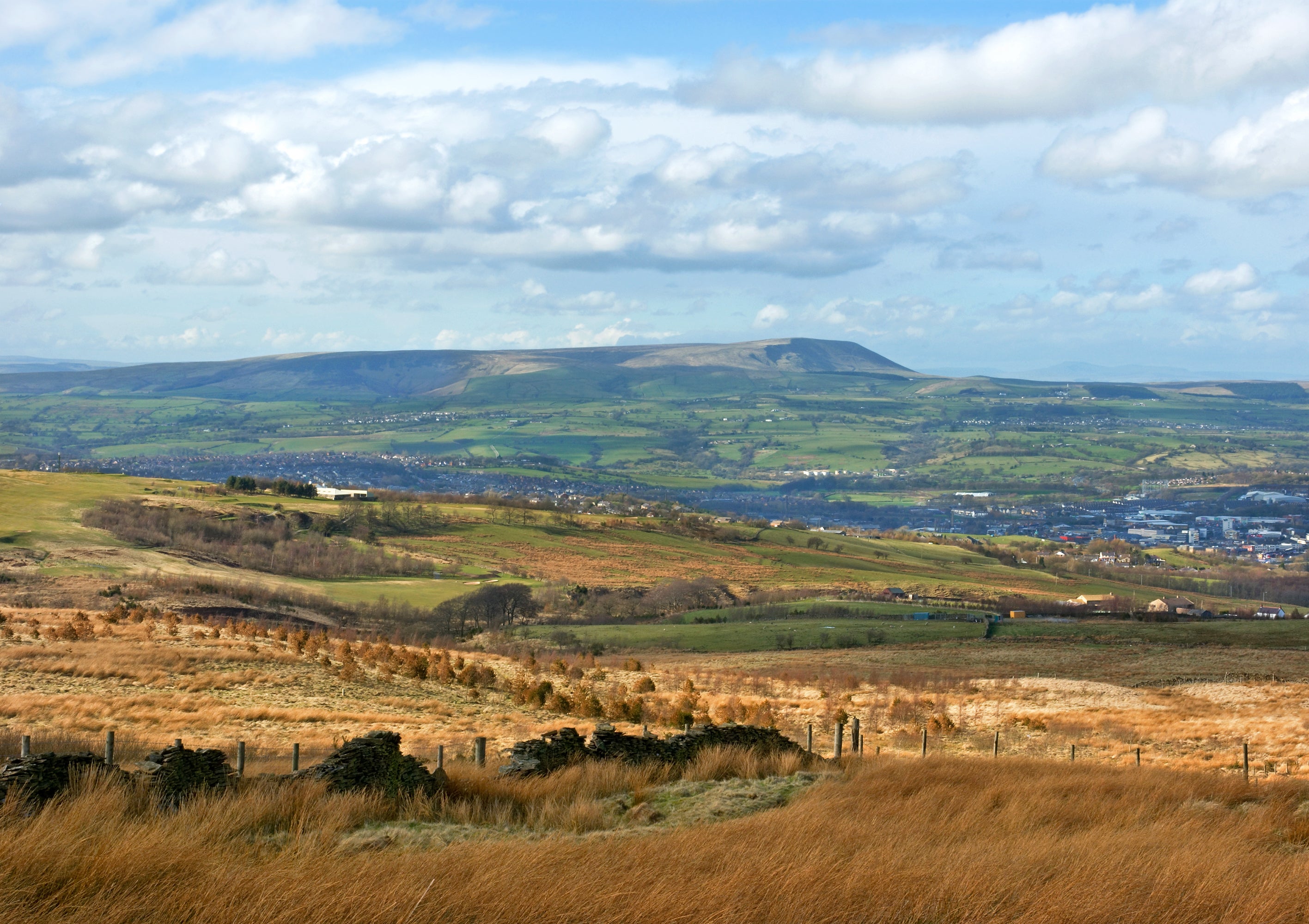 Burnley (pictured here by Pendle hill), Bolton, Oldham and other great Pennine towns also have a considerable cotton history