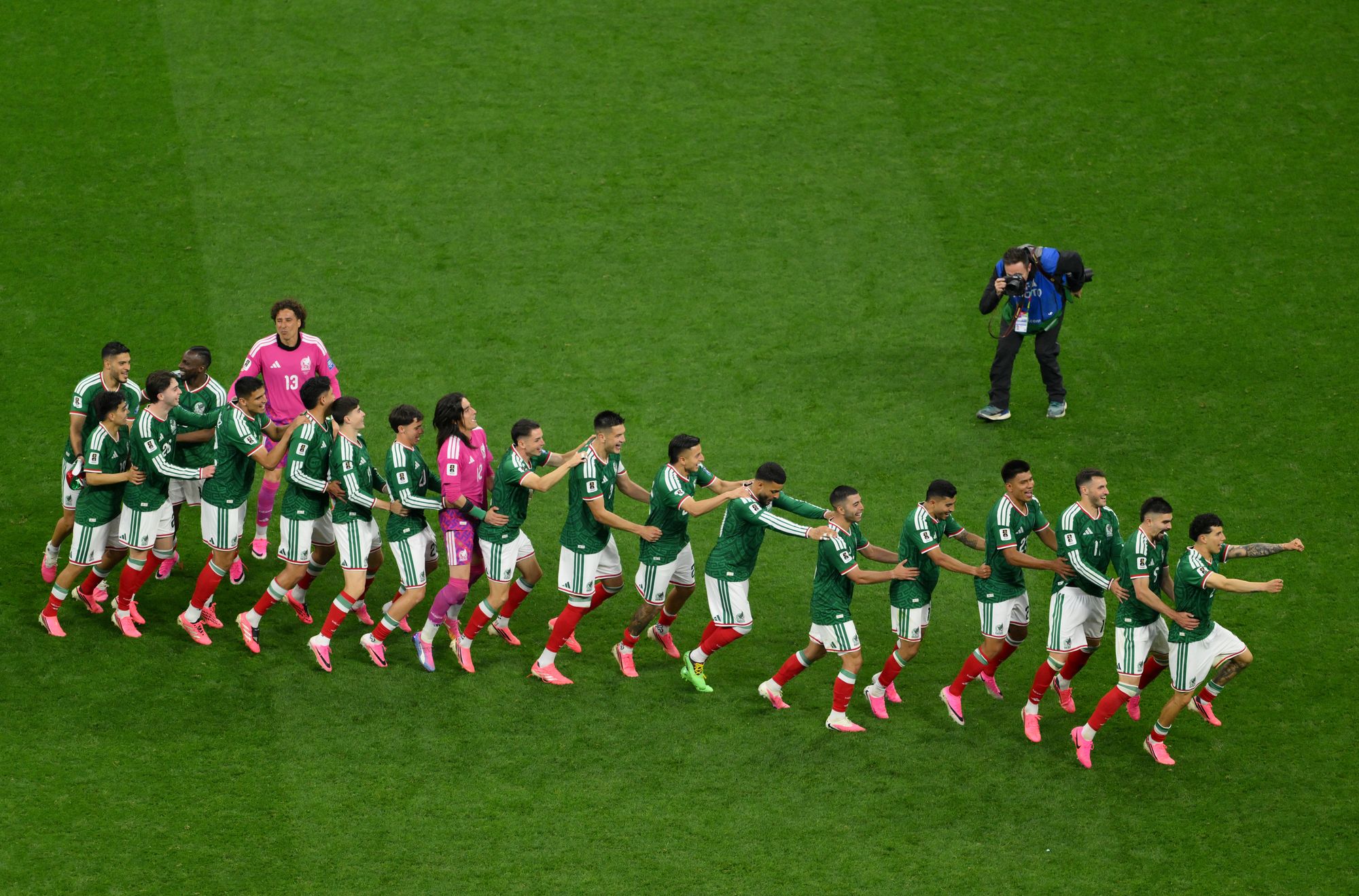 Players of Mexico celebrate by dancing after the team's victory