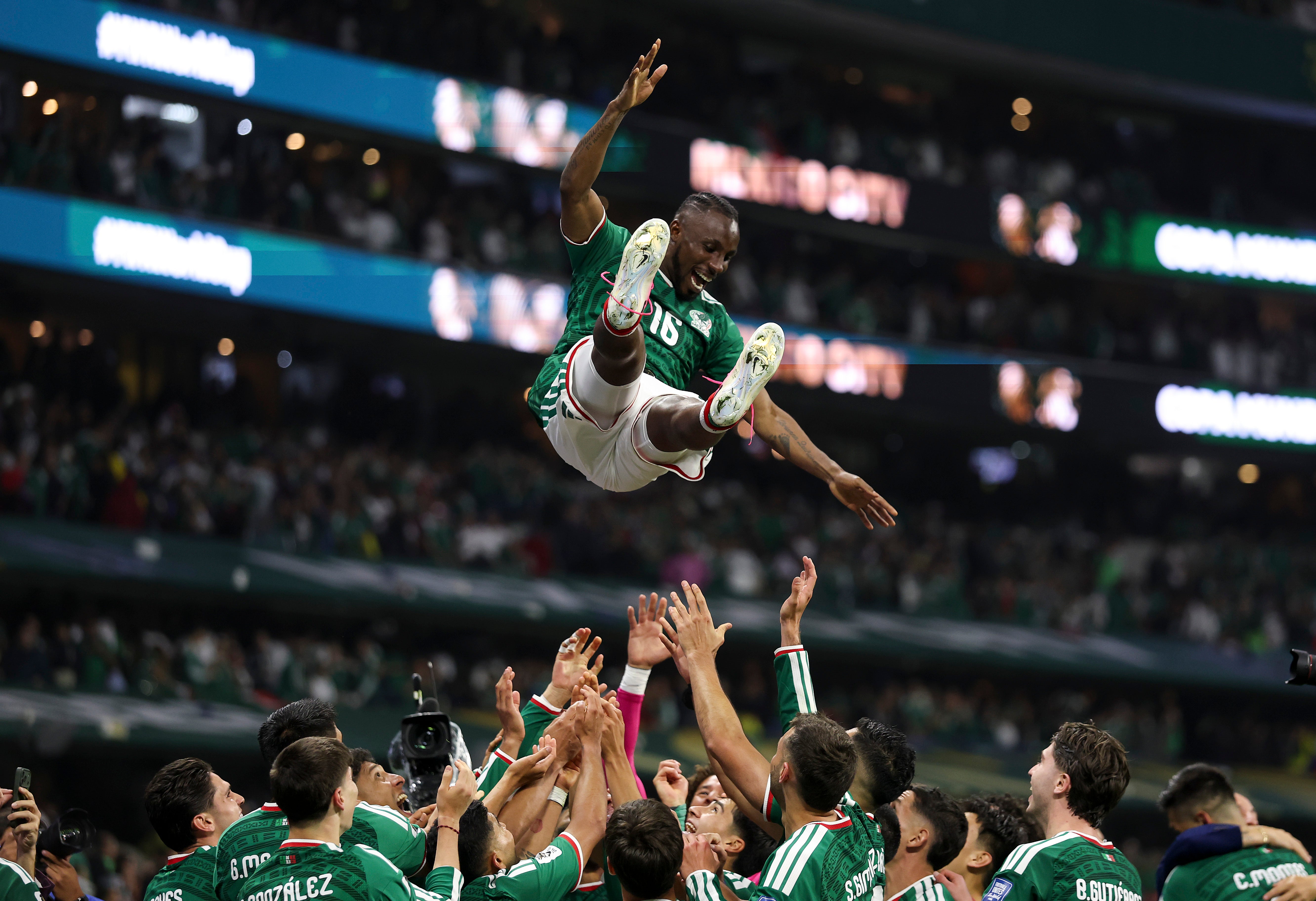 Julian Quinones #16 of Mexico is thrown in the air by team mates as they celebrate after the team's victory