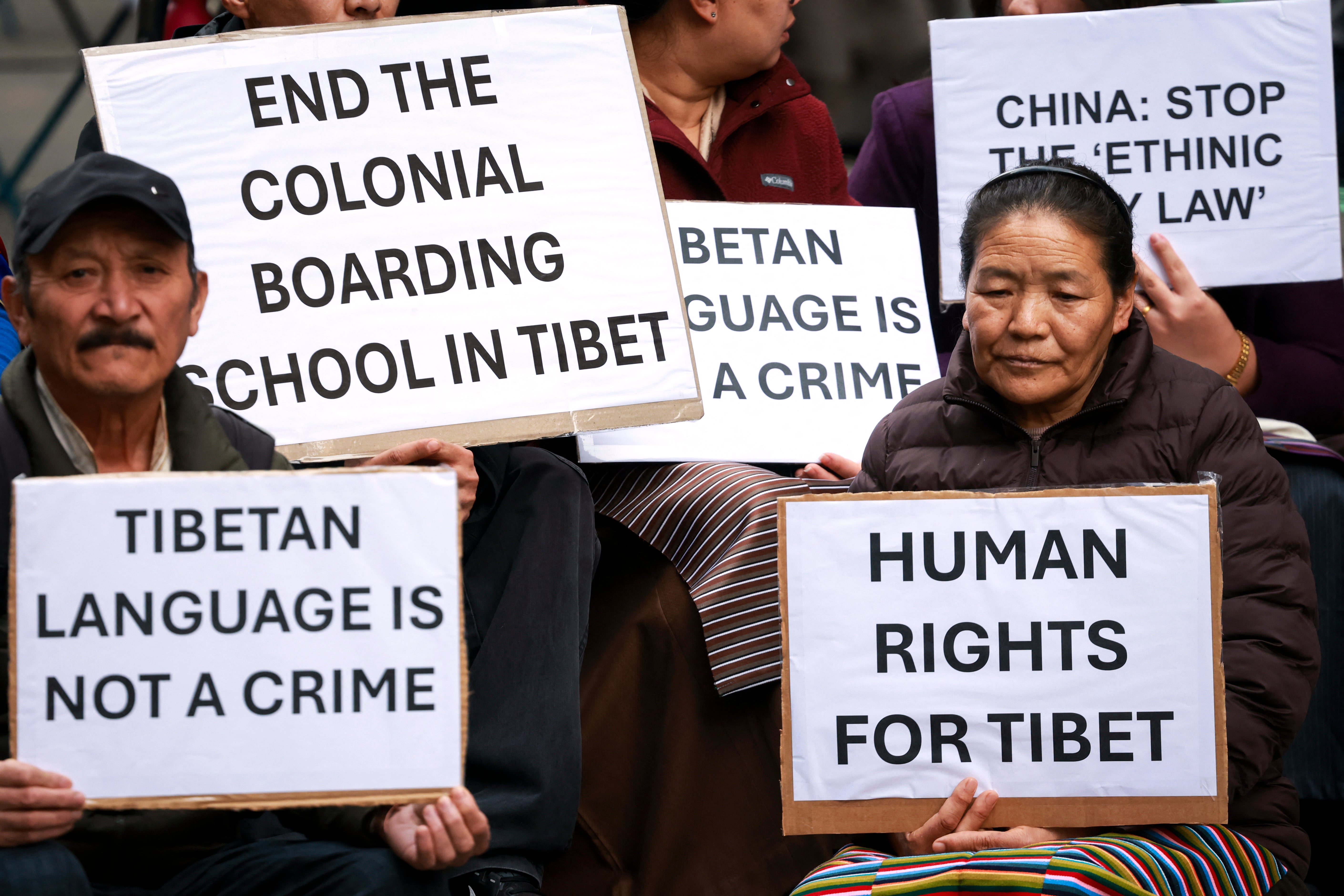 File. Members of the Australian Tibetan community react as they hold placards during a protest in Sydney on 1 July 2026