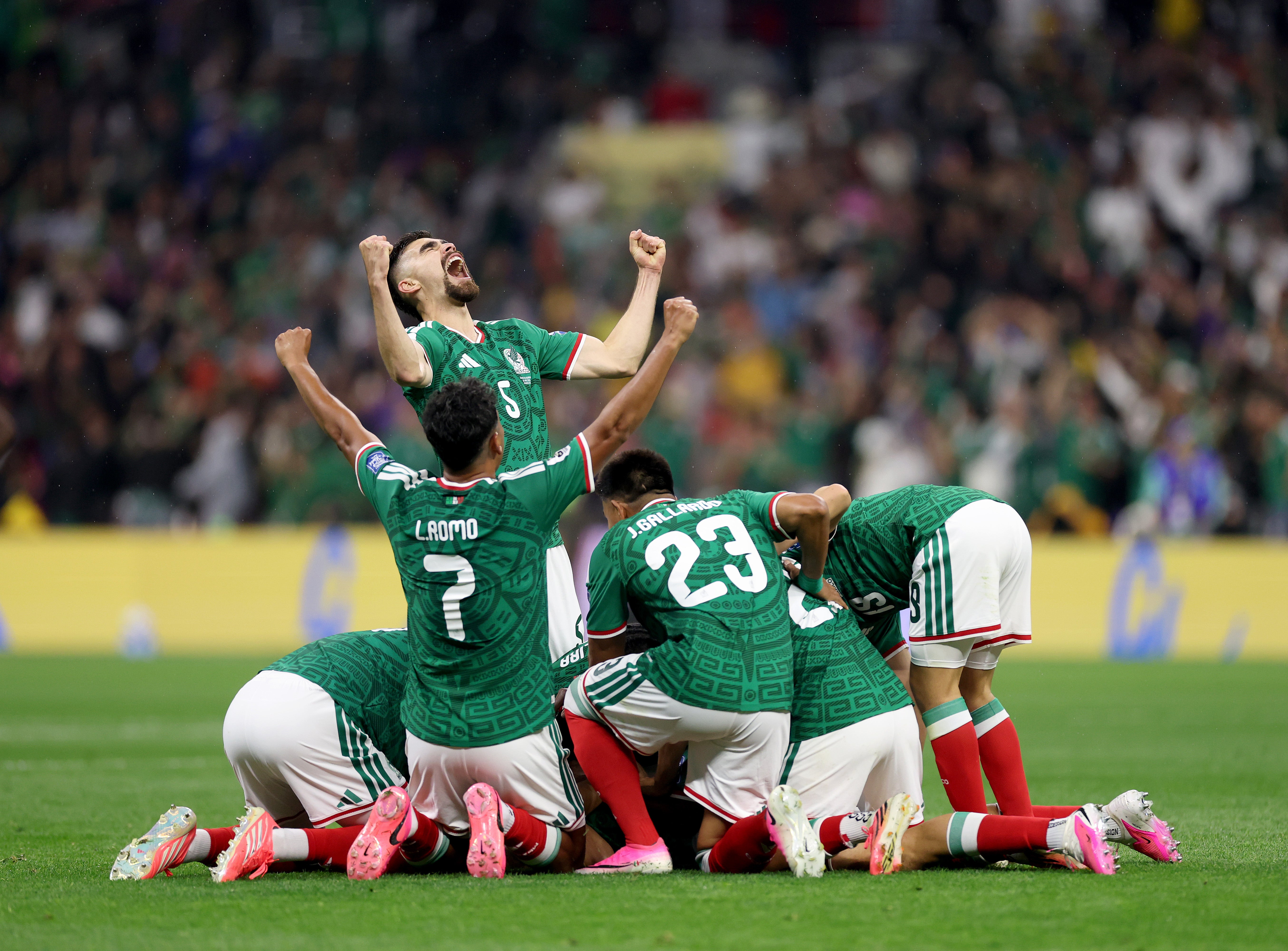 Raul Jimenez of Mexico celebrates scoring his team's second goal with team mates