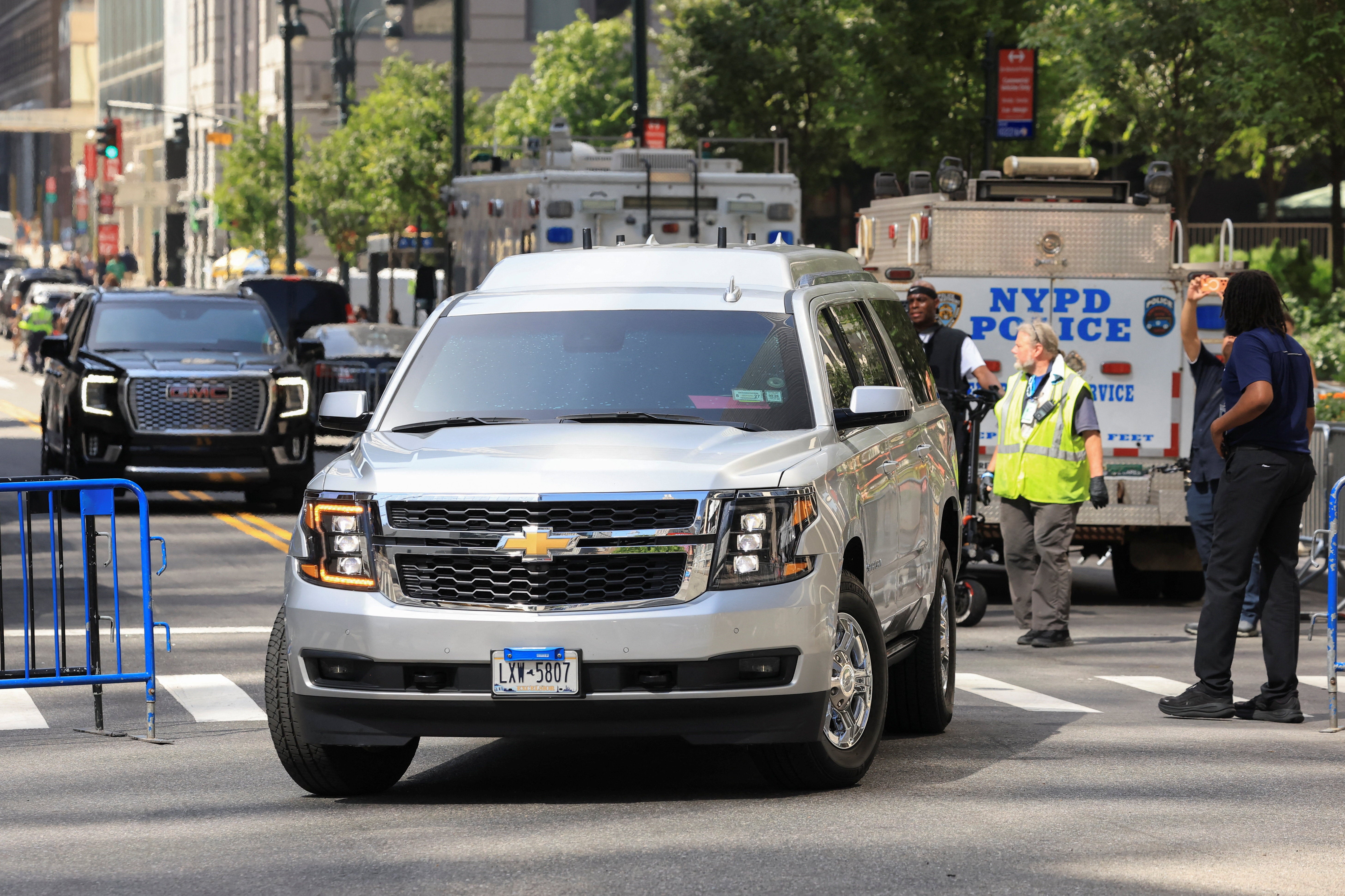 Officers, pictured here Thursday, directing an SUV believed to be carrying Swfit, said the alleged wedding venue being MSG is a ‘huge inconvenience’ for the entire city