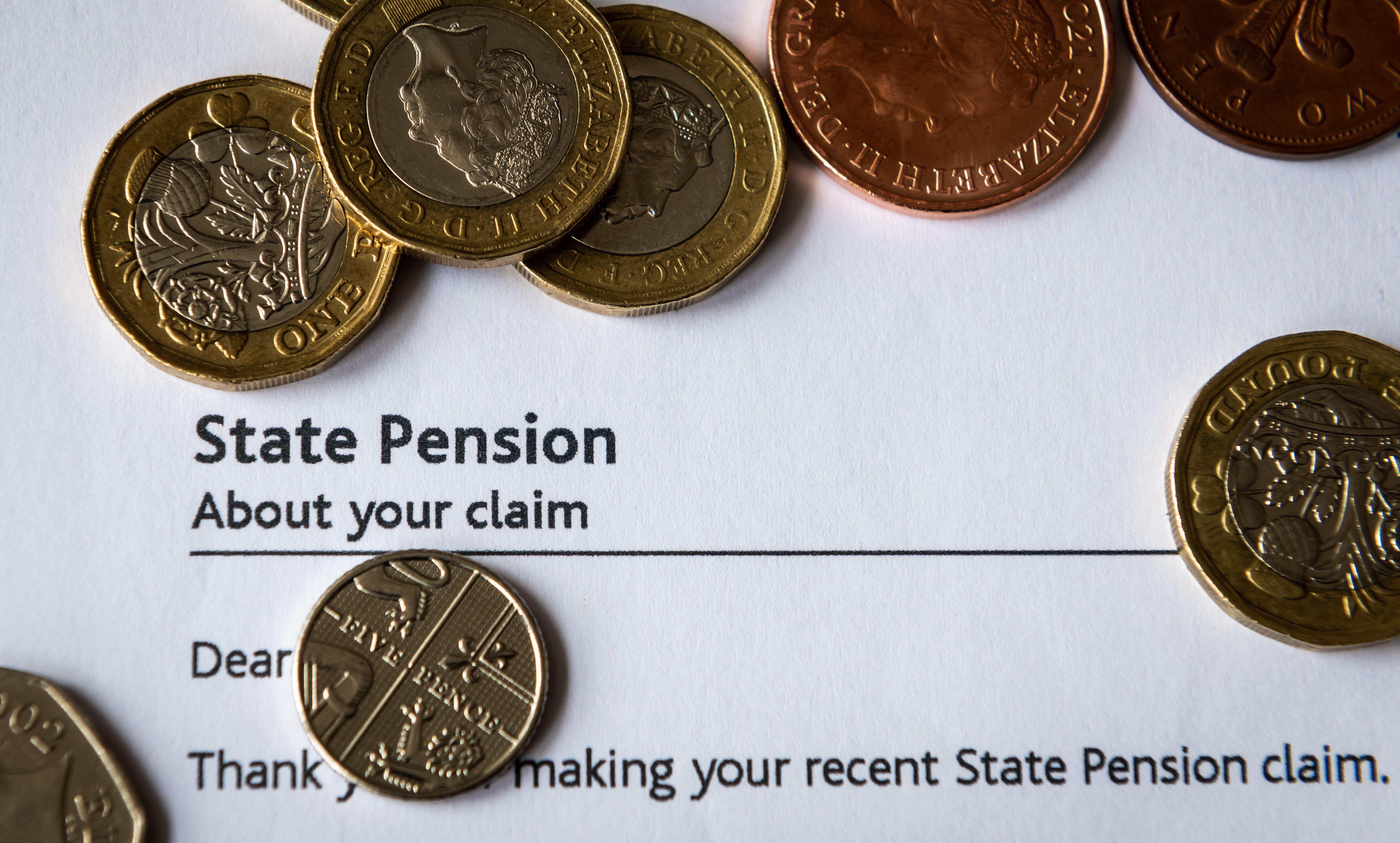 Coin on top of a state pension claim letter (Alamy/PA)