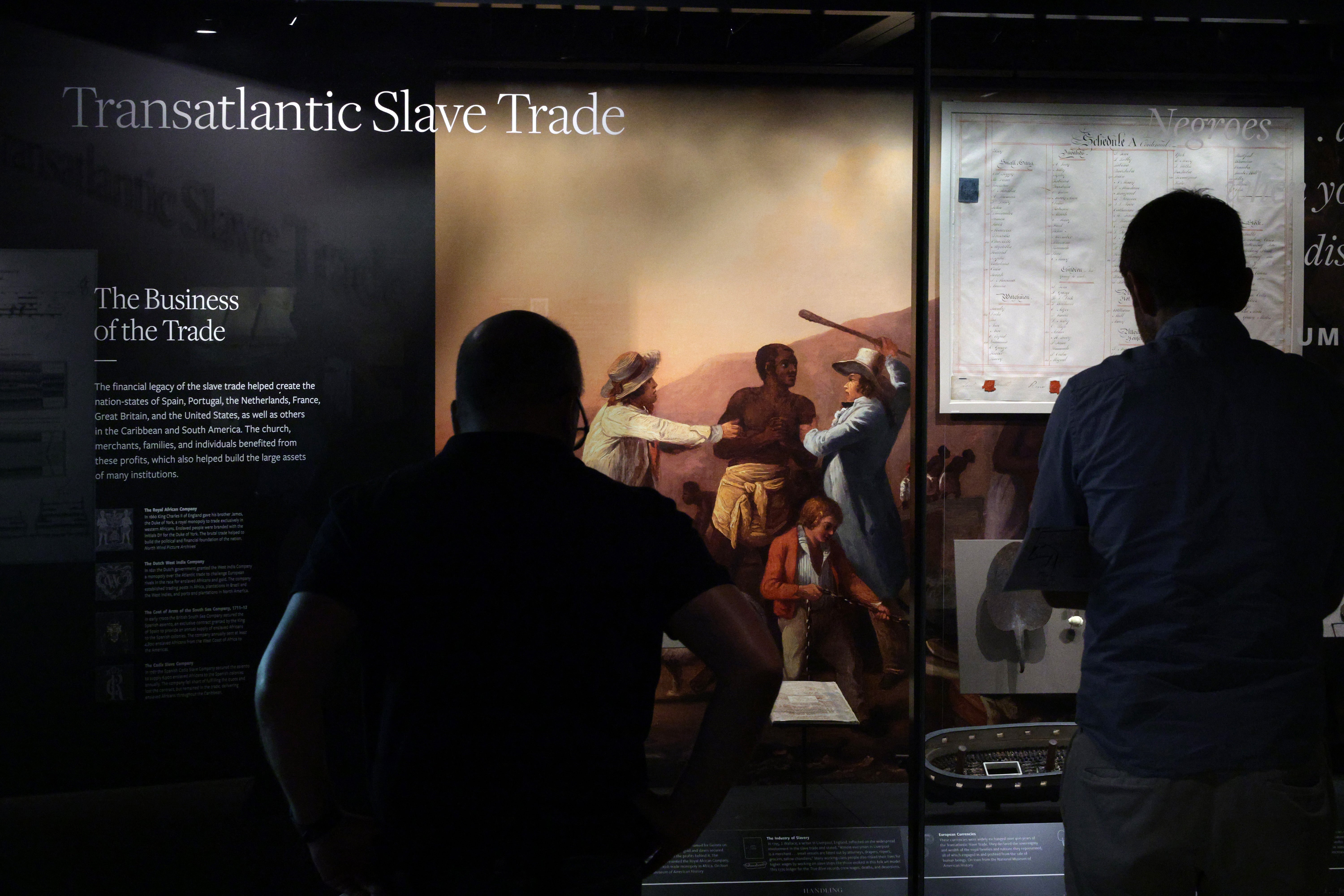 Visitors browse an exhibition about slavery in the United States of America at the National Museum of African American History and Culture on August 28, 2025