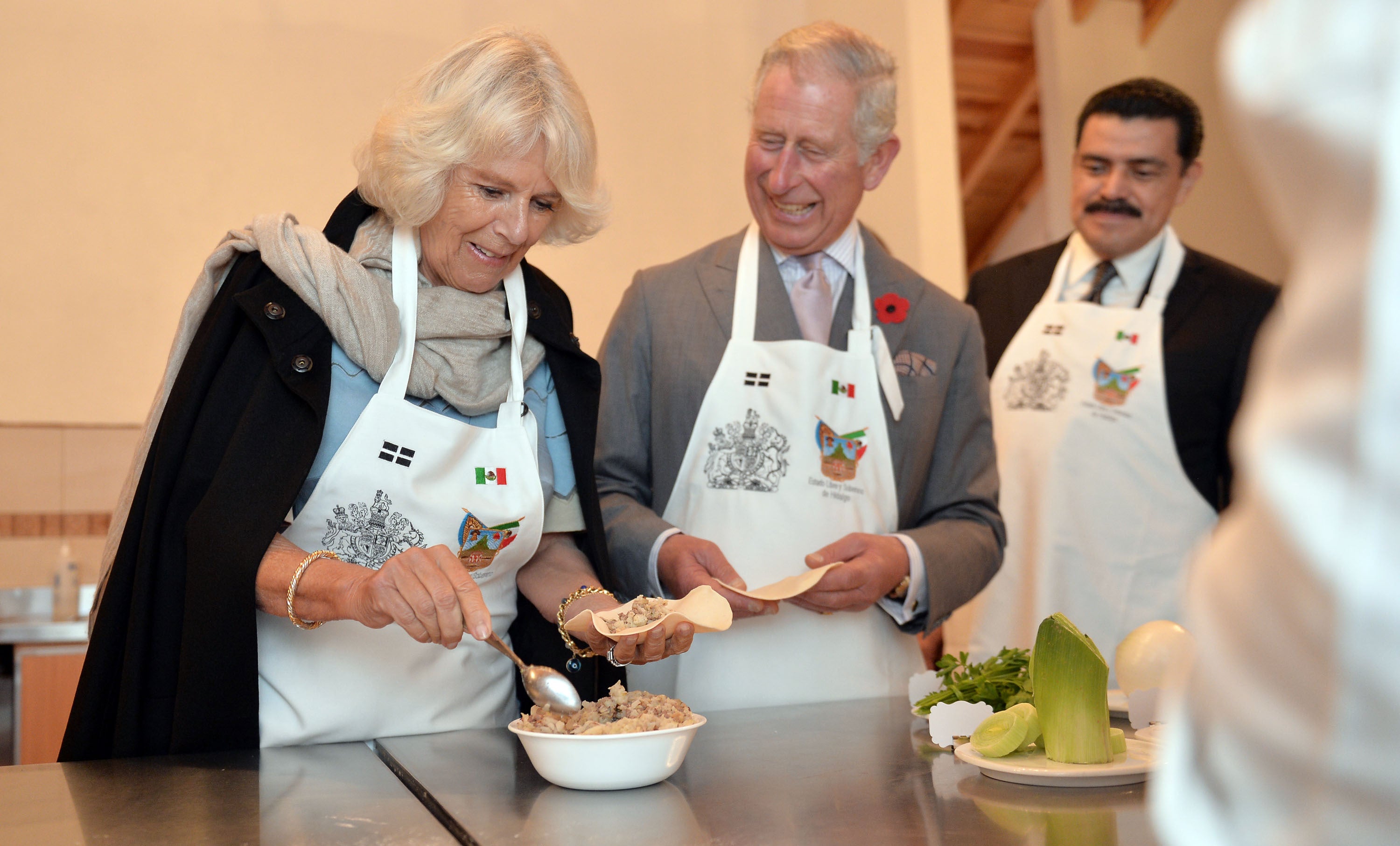 Prince Charles, Prince of Wales and Camilla, Duchess of Cornwall make pasties during their visit to the Pasty Museum in Real del Monte on the 'Day of the Dead' on November 2, 2014 in Hidalgo, Mexico
