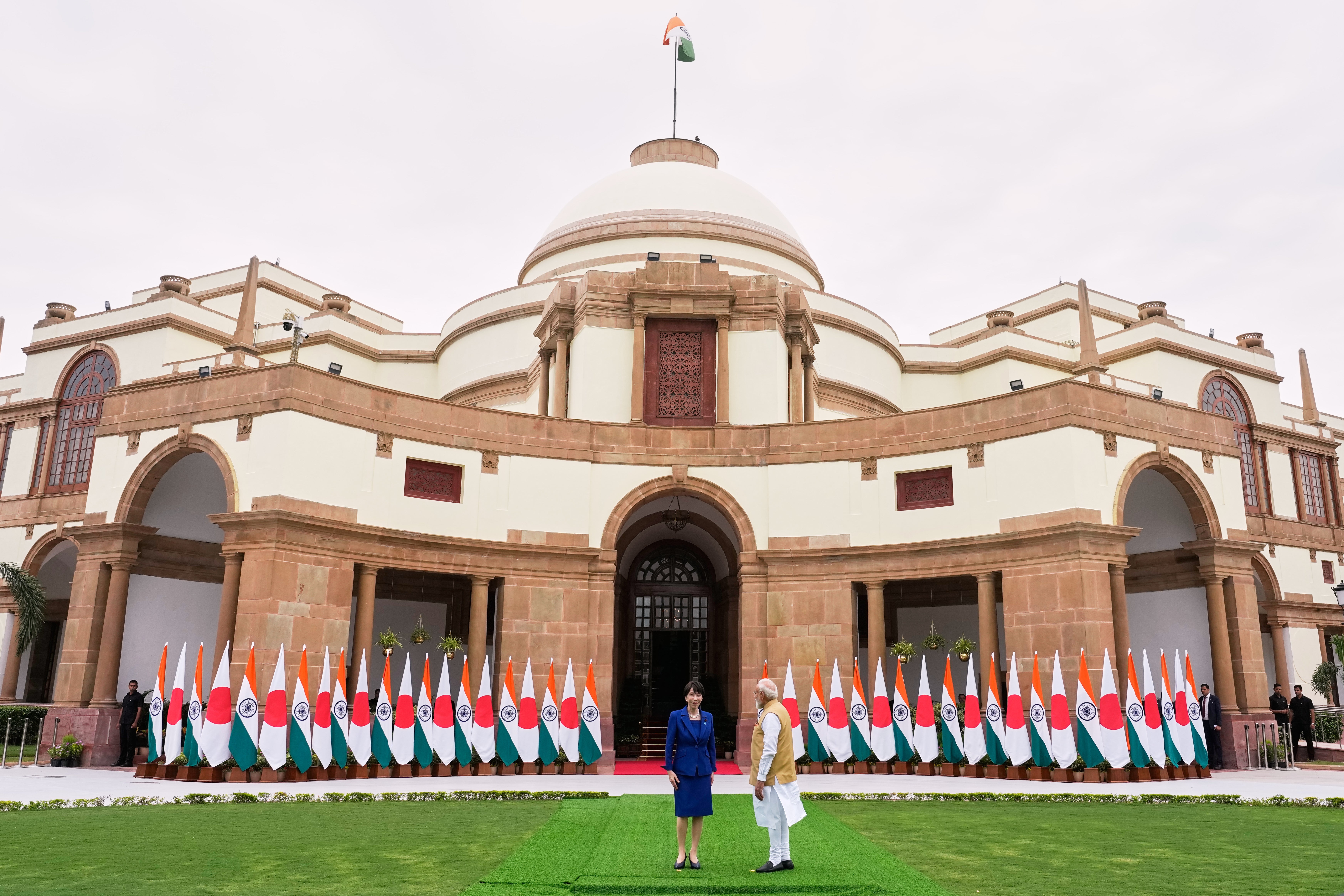 Japanese Prime Minister Sanae Takaichi, left, and Indian Prime Minister Narendra Modi prepare to leave after posing for photographs before their delegation level meeting in New Delhi, India, Thursday