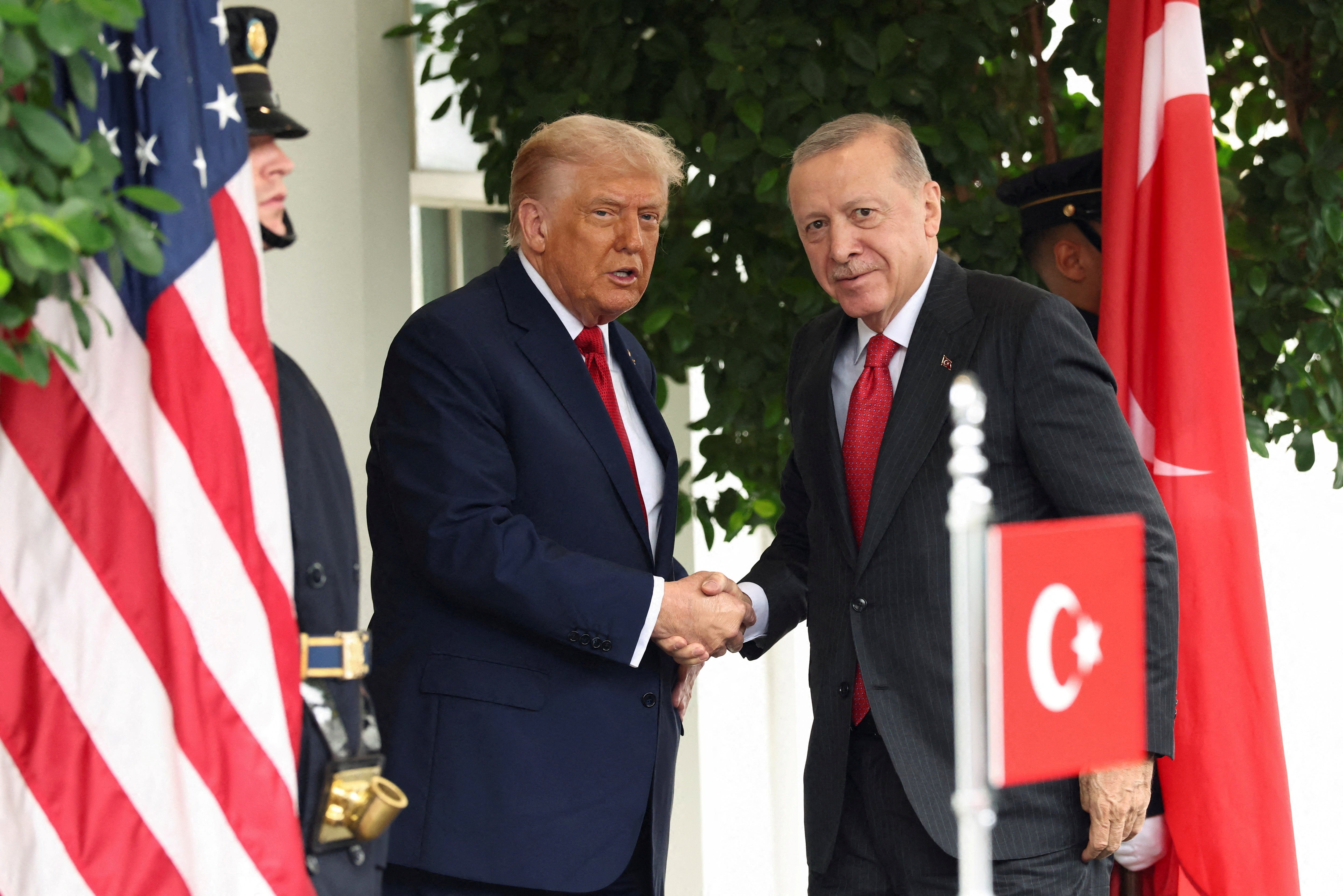 U.S. President Donald Trump and Turkey's President Recep Tayyip Erdogan shake hands as they meet at the White House in Washington, D.C., U.S., September 25, 2025